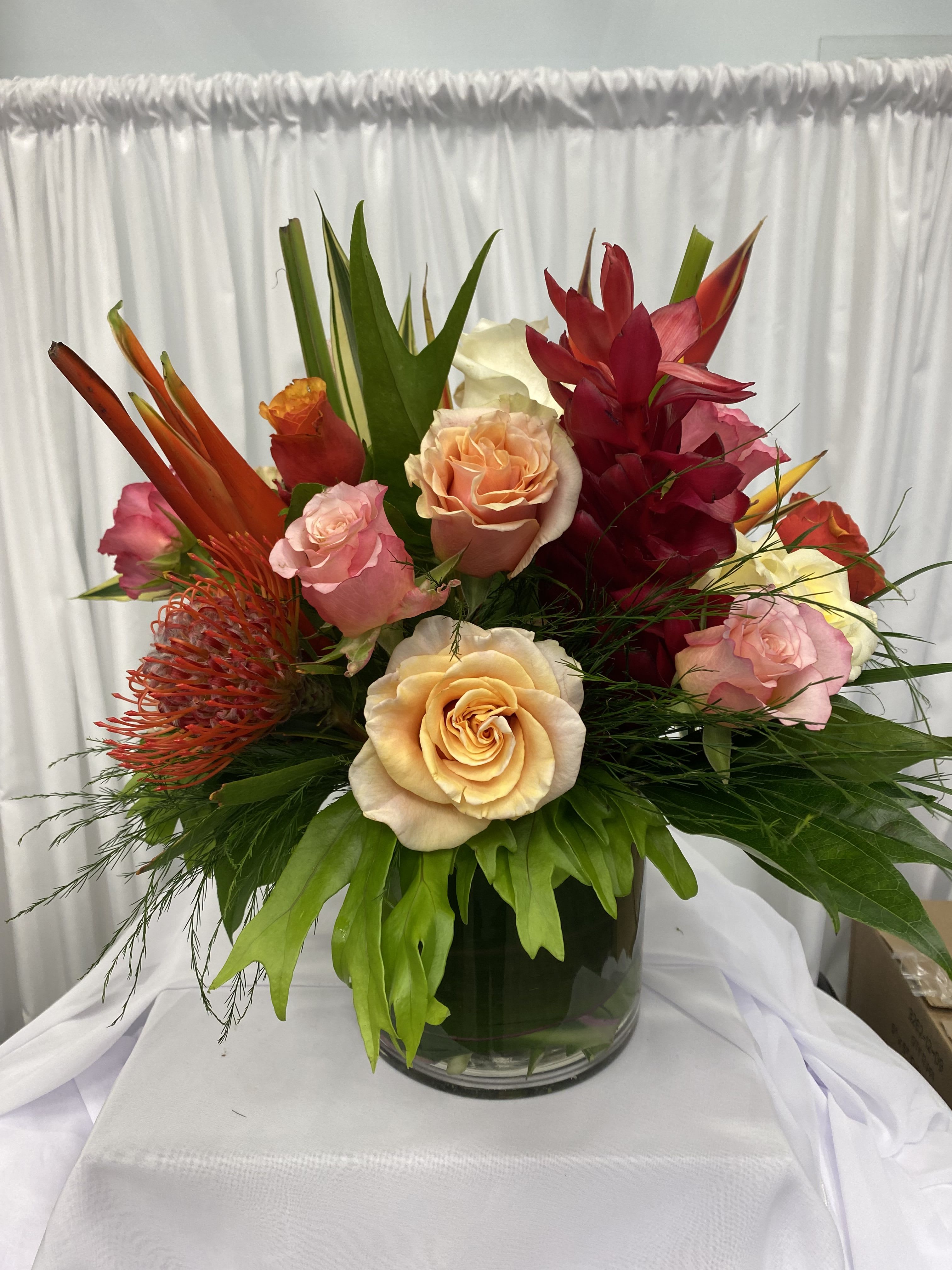 Tropical Bliss Bouquet  -  Embrace the beauty and vibrancy of the tropics with our stunning Tropical Bliss Bouquet. Featuring a dazzling array of colorful, exotic flowers, this arrangement instantly adds a touch of paradise to your everyday. Perfect for any space or occasion, the Tropical Bliss Bouquet is a vibrant escape from the ordinary.