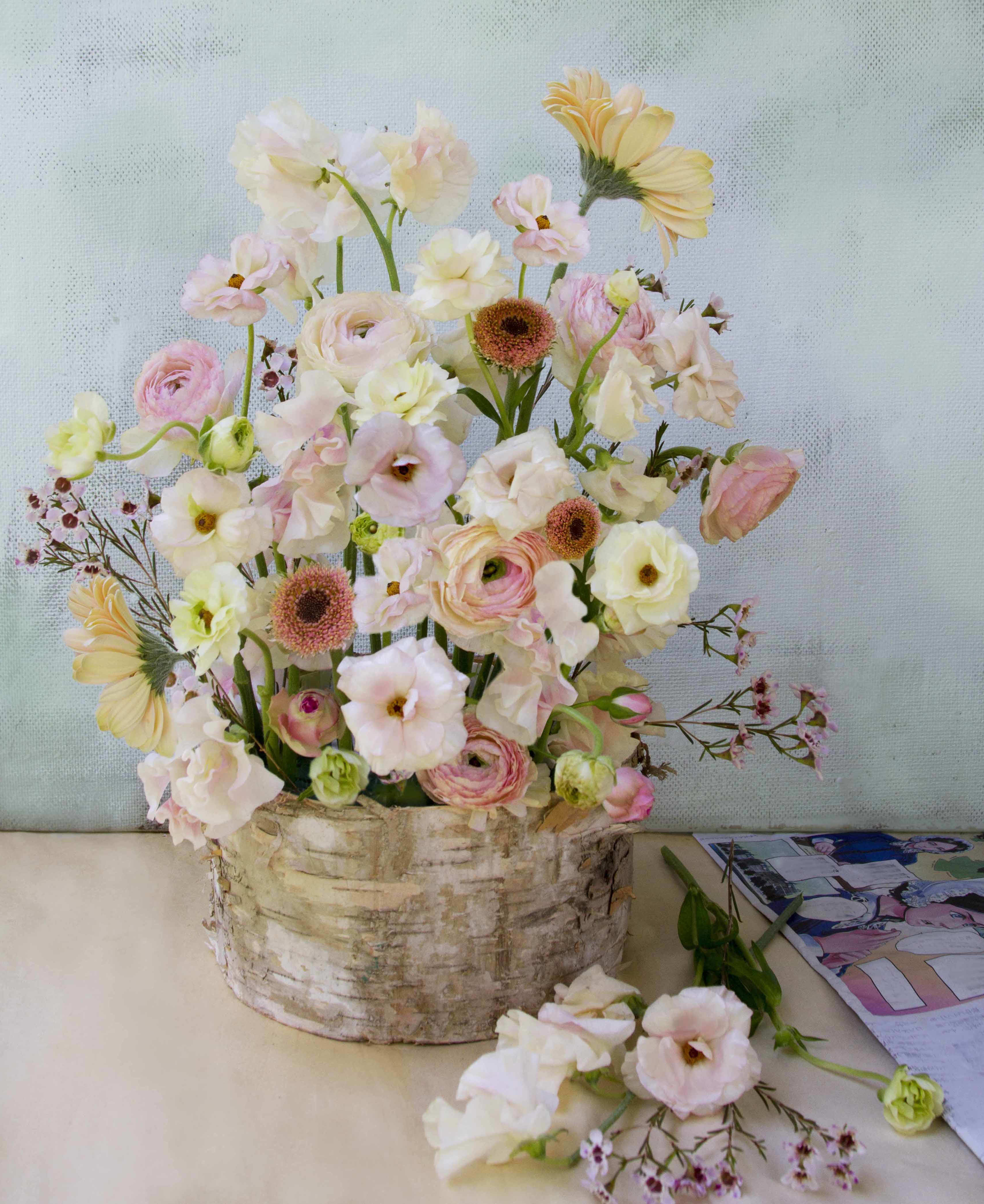 Angelina Arrangement - Natural and garden like yet elegant arrangement in a decorative container made of natural bark size 6&quot; by 3&quot;. Sweetpeas, ranunculus, wax flowers, spray roses and a few gerbera daisies - all in dreamy poetic colors arranged beautifully. (Upgrade to deluxe or premium for a larger version with more flowers.  Blomst LA only uses fresh, high quality flowers, all carefully selected every day to fit your flower order. You can see the design made for happy customer on images shown, at different times of year (with a slight variation on the flowers). We offer a personal hand delivery by our own delivery staff and guarantee the flowers will look perfect, when they arrive. We deliver in Glendale, Pasadena, Eagle Rock, Hollywood, Burbank, Beverly Hills - and everywhere else in Greater Los Angeles. 