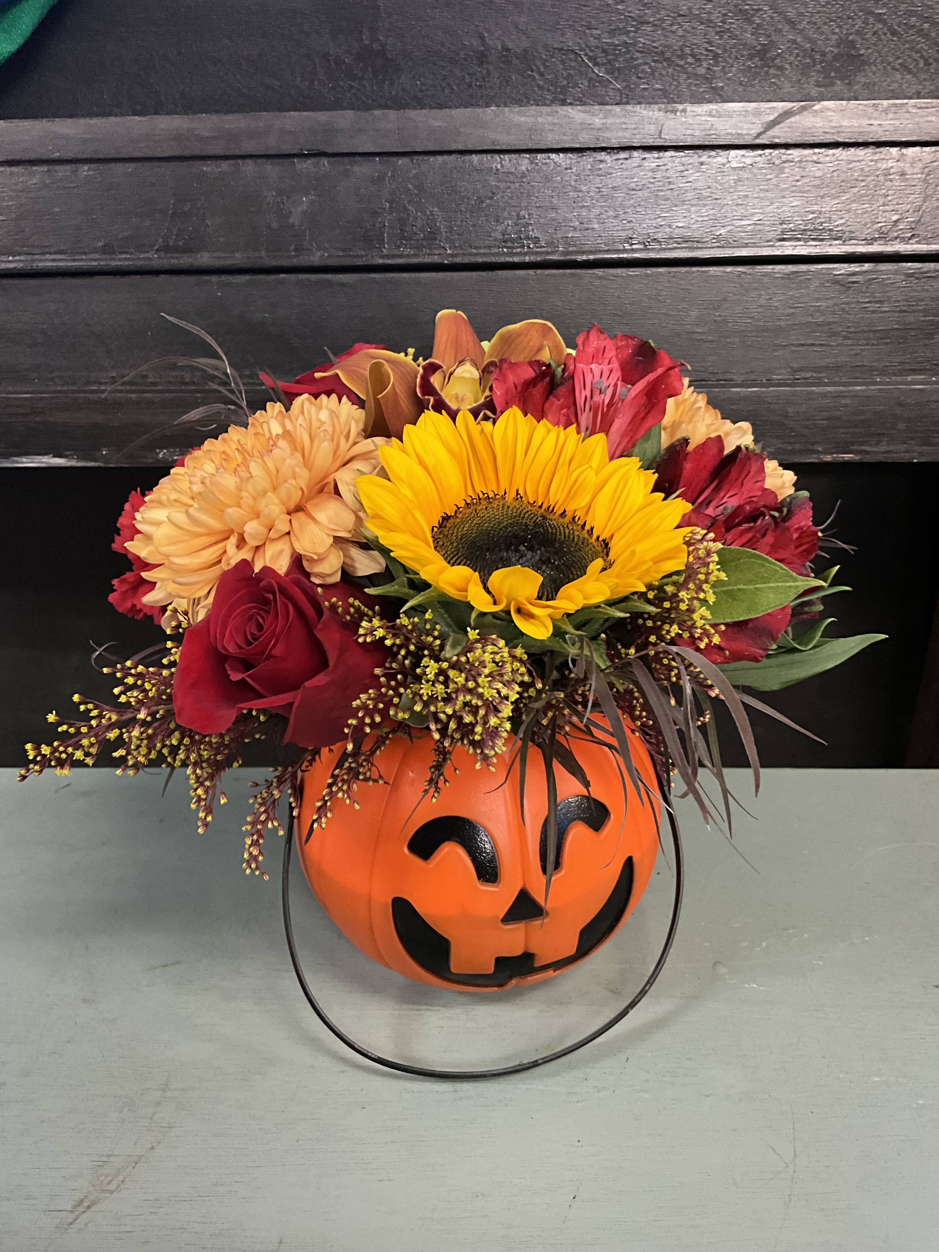 Jack O’ Flowers  - Send a Jack O’ Lantern pumpkin arrangement ideal for the season. Our designer will pick out the freshest colorful fall themed flowers. The photos represent an overall design of the possible outcome, not an exact look in flowers. 