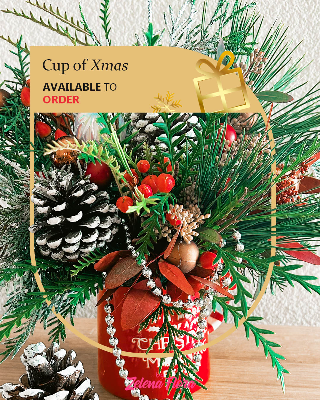 Cup of Xmas Cup of Xmas - This festive Christmas cup arrangement radiates holiday cheer with its vibrant and cozy design. The bright red cup, adorned with a cheerful Christmas quote, holds a beautiful display of pine branches, frosted pinecones, bright red berries, and sprigs of greenery. Additional touches include bronze ornaments, candy cane accents, and a playful silver bead garland, creating a perfect holiday centerpiece or gift.