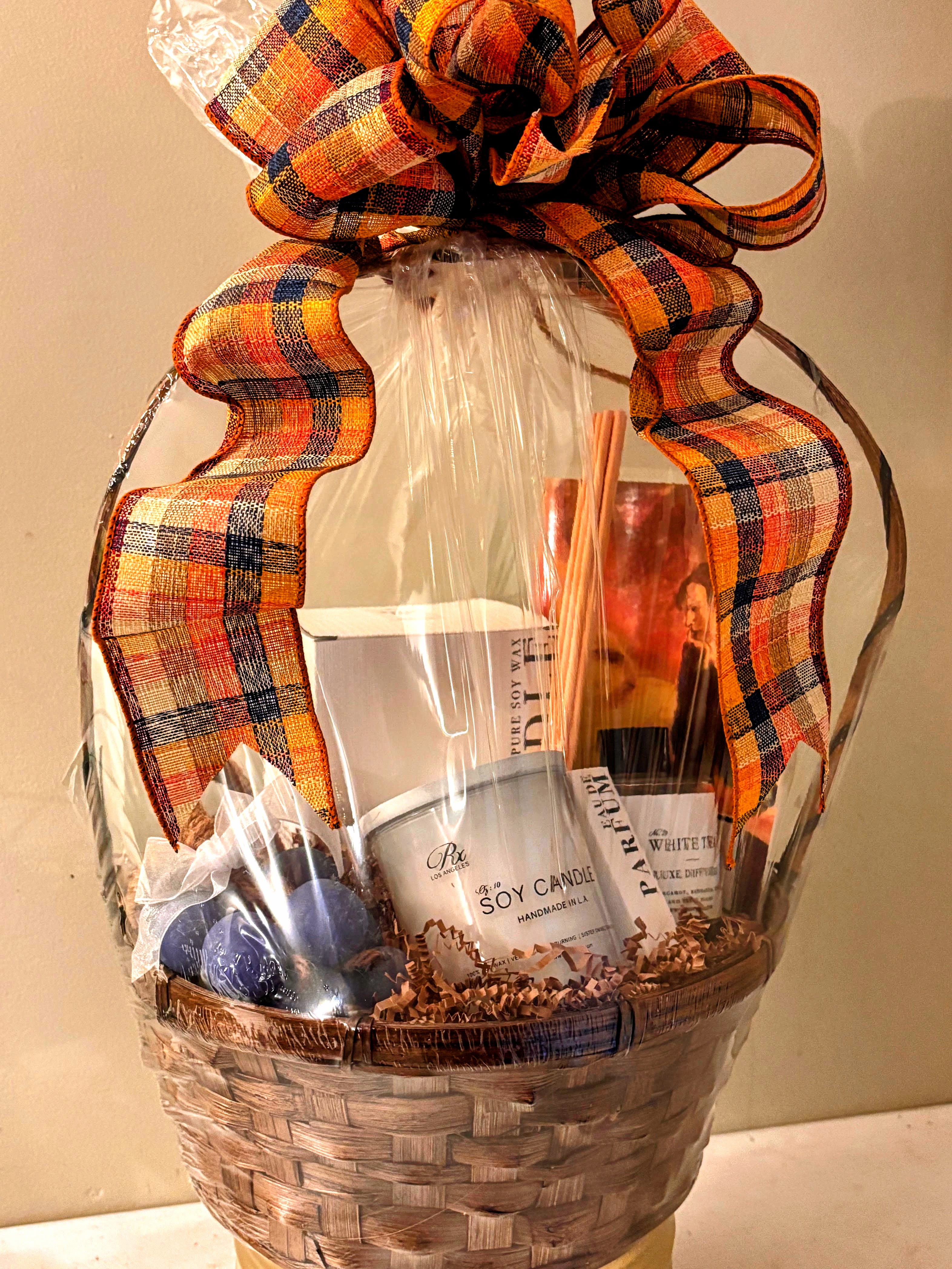 Basket - Here's a detailed product description that includes a variety of items: Candles, diffusers, travel-sized perfumes, a thoughtfully curated poetry book, and a selection of exquisitely handmade soaps. If you'd like, you can also add candies or chocolates separately, providing customers with a clear and organized selection of delightful options.