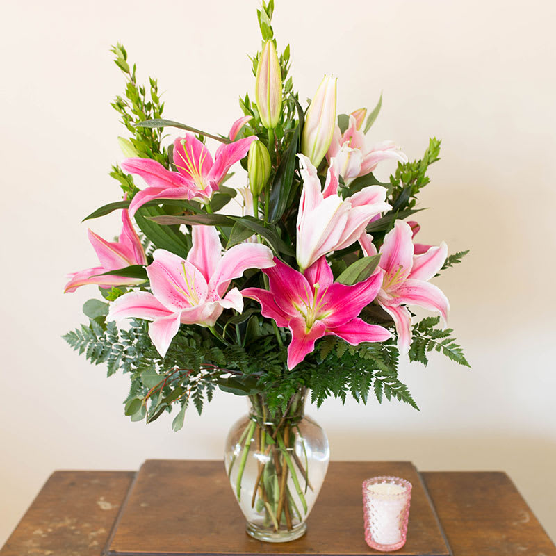 Stargazer Delight  - This elegant arrangement of stargazer lilies is sure to amaze anyone.