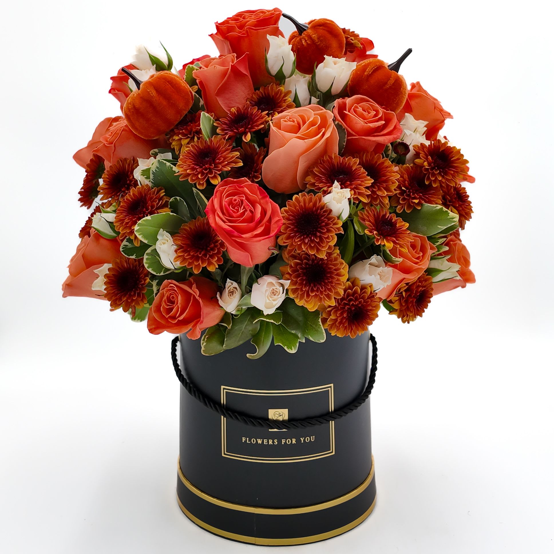 Pumpkin Patch - Includes Orange Roses, Orange Pom Button, Peach Spray Roses, Varigated Greenery, and Pumpkin Decor  In Black Cylinder Box  Size: 7x6