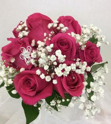 Prom BVP4 - Rosy Posy Handheld Bouquet Prom BVP4 - Rosy Posy Handheld Bouquet - A lovely bouquet of hot pink roses, baby's breath, and greenery. This bouquet is available in other colors, too. Please call if you would like to choose a different color rose. *Gemstone pictured not available. This will be substituted with rhinestone sprays.