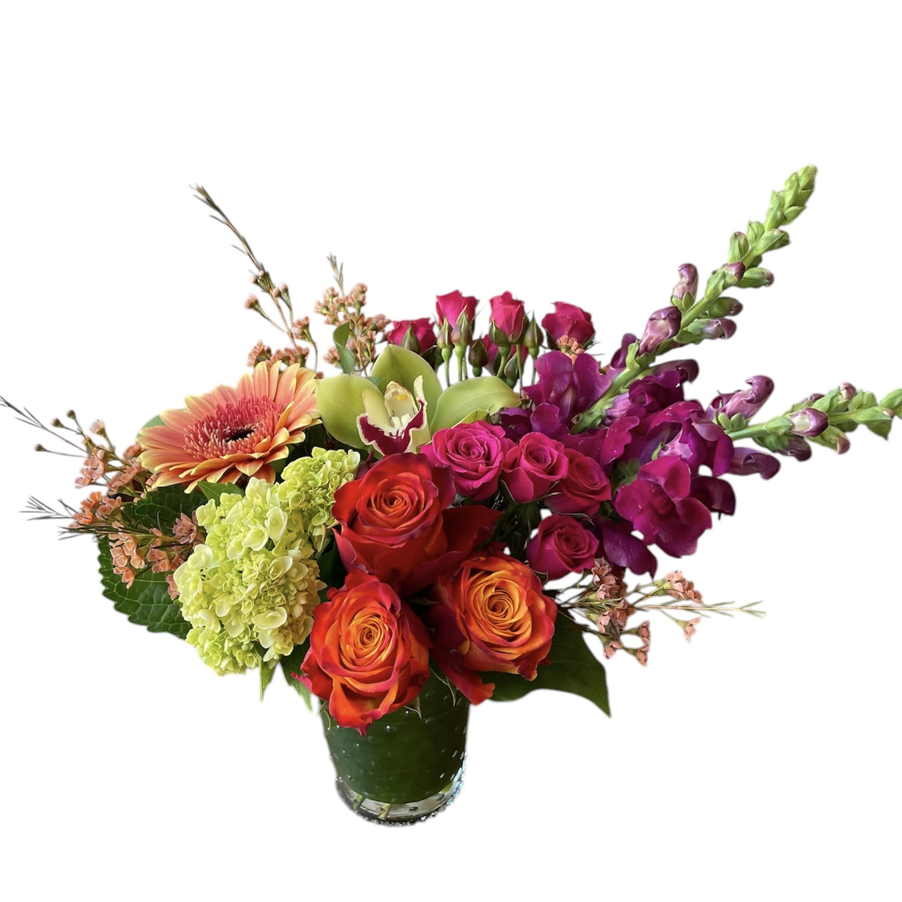 Bright Cider Bright Cider - Orange roses, hot pink spray roses, green hydrangea, peach gerbera daisy, pink snapdragon, green cymbidium orchid and wax flower designed in a glass vase. As shown in photo.