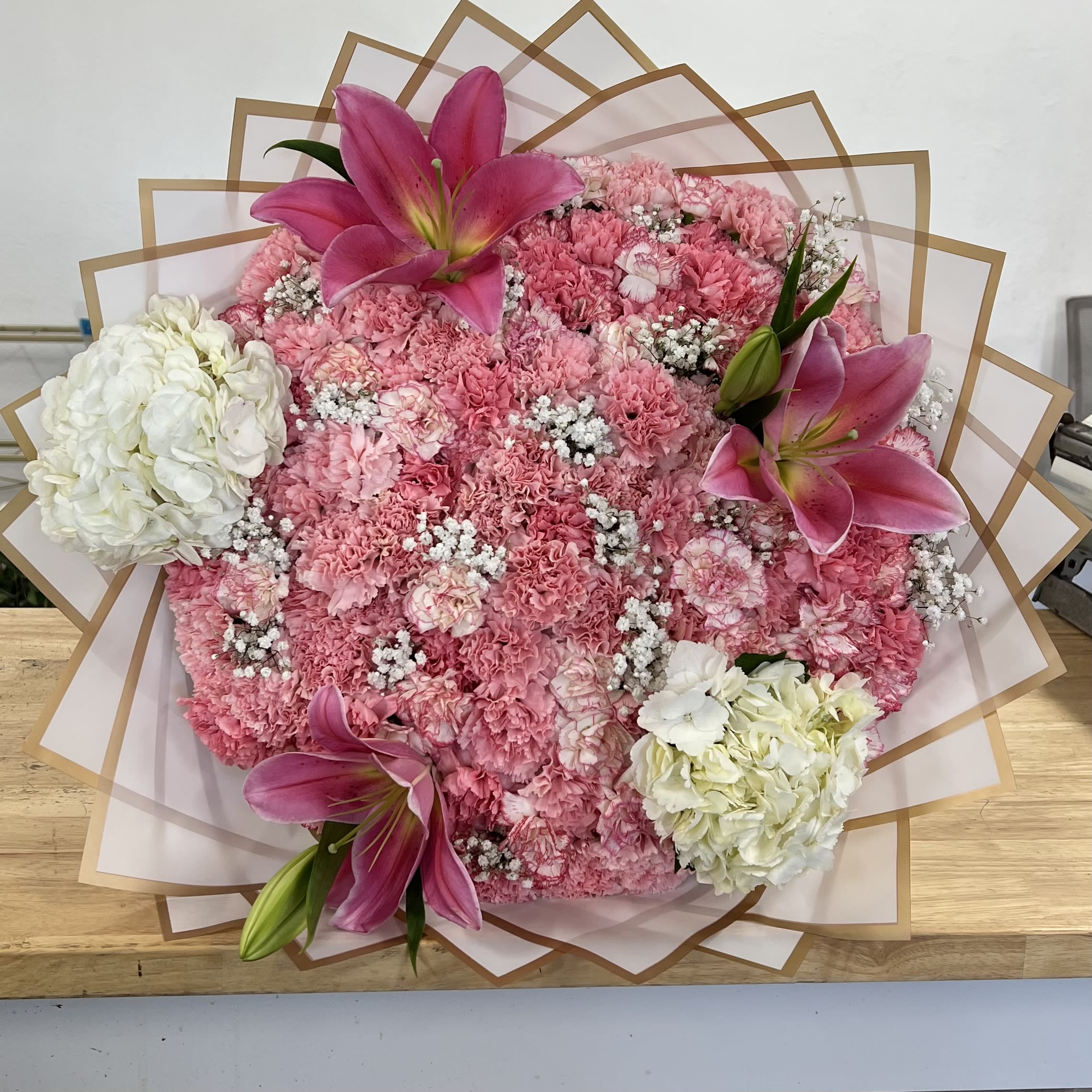 Bouquet With Carnations, Lillies, Hydrangeas  - Buyer will receive a beautiful bouquet with pink carnations, pink Lillie’s and white Hydrangeas.