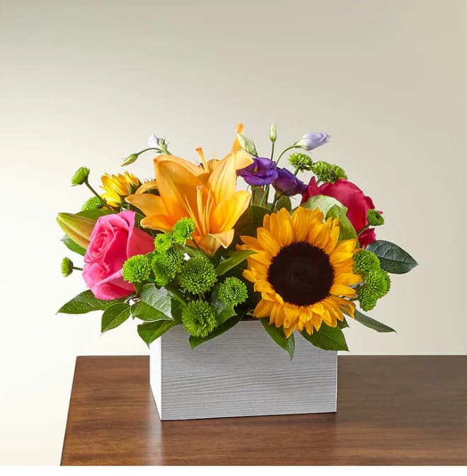 Best Day Box Bouquet - Who knew their best day could be delivered in a box? We did, with the help of a local florist to handcraft one of the most popular bouquets celebrating any occasion.  Please Note: The bouquet pictured reflects our original design for this product. While we always try to follow the color palette, we may replace stems to deliver the freshest bouquet possible, and we may sometimes need to use a different vase.