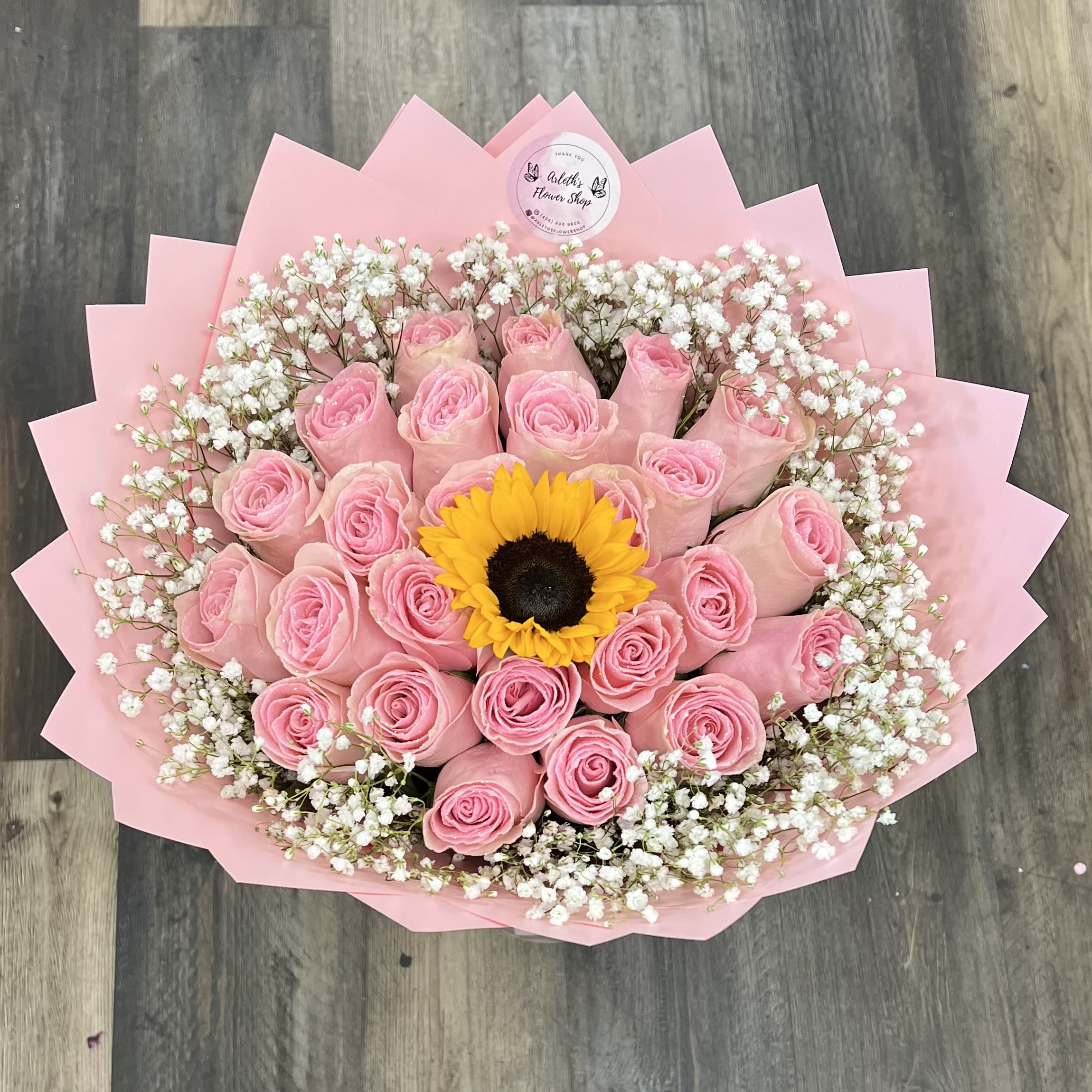 25 Pink Roses With Glitter And Sunflower On The Middle  - Buyer will receive 24 roses, 1 sunflower and Babybreath around. 