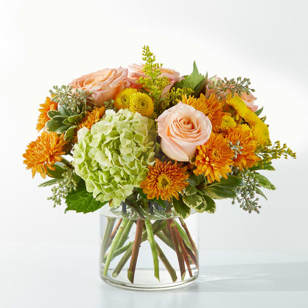 Fall Foliage - Clear vase with hydrangea, peach roses, copper mums and eucalyptus with greenery. 