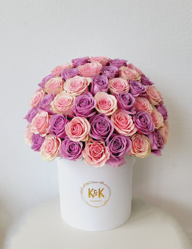 PROMO 50 roses Hatbox Pink and Purple  PROMO 50 roses Hatbox Pink and Purple  - Large hatbox white, with pink and purple roses.   The size of the arrangement is 18" for 13" approx. NOTE: The box is ONE-SIDED. This means that the back of the box will be covered with the box lid. This helps to make the arrangement look bigger! And make a greater impression. If you want it rounded, please specify in the special instructions. SEE ALL PICTURES FOR REFERENCE.