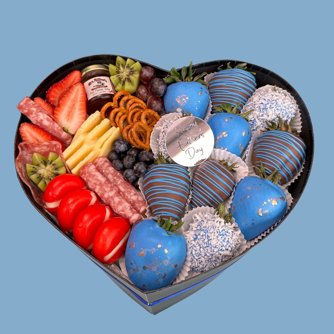 Deluxe Gourmet Heart Box for Him - urprise Dad with this stunning heart-shaped box filled with a delicious mix of blue chocolate-covered strawberries, fresh fruits (strawberries, kiwi, blueberries, grapes), cheeses, salami, pretzels, and a mini artisanal jam.  An elegant, delicious, and original gift that perfectly combines sweet and savory in a unique presentation. Ideal as a gourmet gift for dads in Miami.   Includes a “Happy Father’s Day” tag   Sorprende a papá con esta increíble caja en forma de corazón, contiene una deliciosa combinación de fresas con chocolate azul decoradas, frutas frescas (fresas, kiwi, arándanos, uvas), quesos, salami, pretzels, y una mini mermelada artesanal.  Una opción elegante, deliciosa y original que combina lo dulce y lo salado en una presentación única. Ideal como regalo gourmet para papás en Miami.   Incluye etiqueta “Happy Father’s Day”