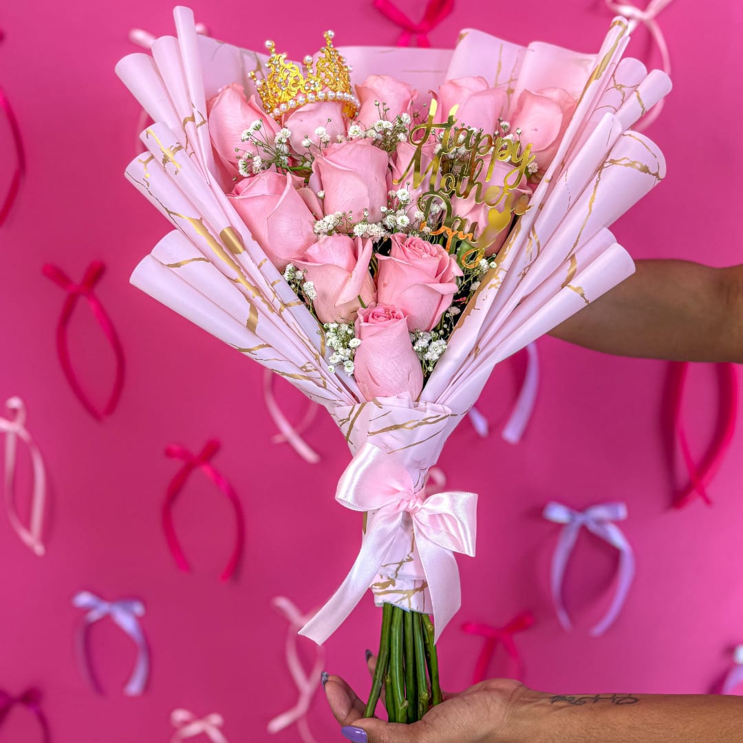 Bouquet Reina Rosa - Mother's Day Roses | Rose Mother's Day Flower Delivery.  Send ours Roses Queen Mother's day  Bouquet, Celebrate the queen of your life with this elegant bouquet of 10-12 pink roses wrapped in luxury marble-style paper. Featuring a golden crown accent and a “Happy Mother’s Day” topper, this bouquet is designed to make her feel truly special.  Includes:   10-12 premium long-stem pink roses  Elegant pink &amp; gold marble wrap with satin ribbon  Decorative golden crown detail  Gold “Happy Mother’s Day” acrylic topper  Accented with baby’s breath (Gypsophila) for a soft, romantic look  Handheld bouquet style – ready to gift  Guaranteed delivery for Mother’s Day (Sunday, May 12)  Perfect for:   Celebrating your mom, grandma, or mother figure  A royal touch for a queen’s heart  Handcrafted in Miami Springs | Local delivery available  