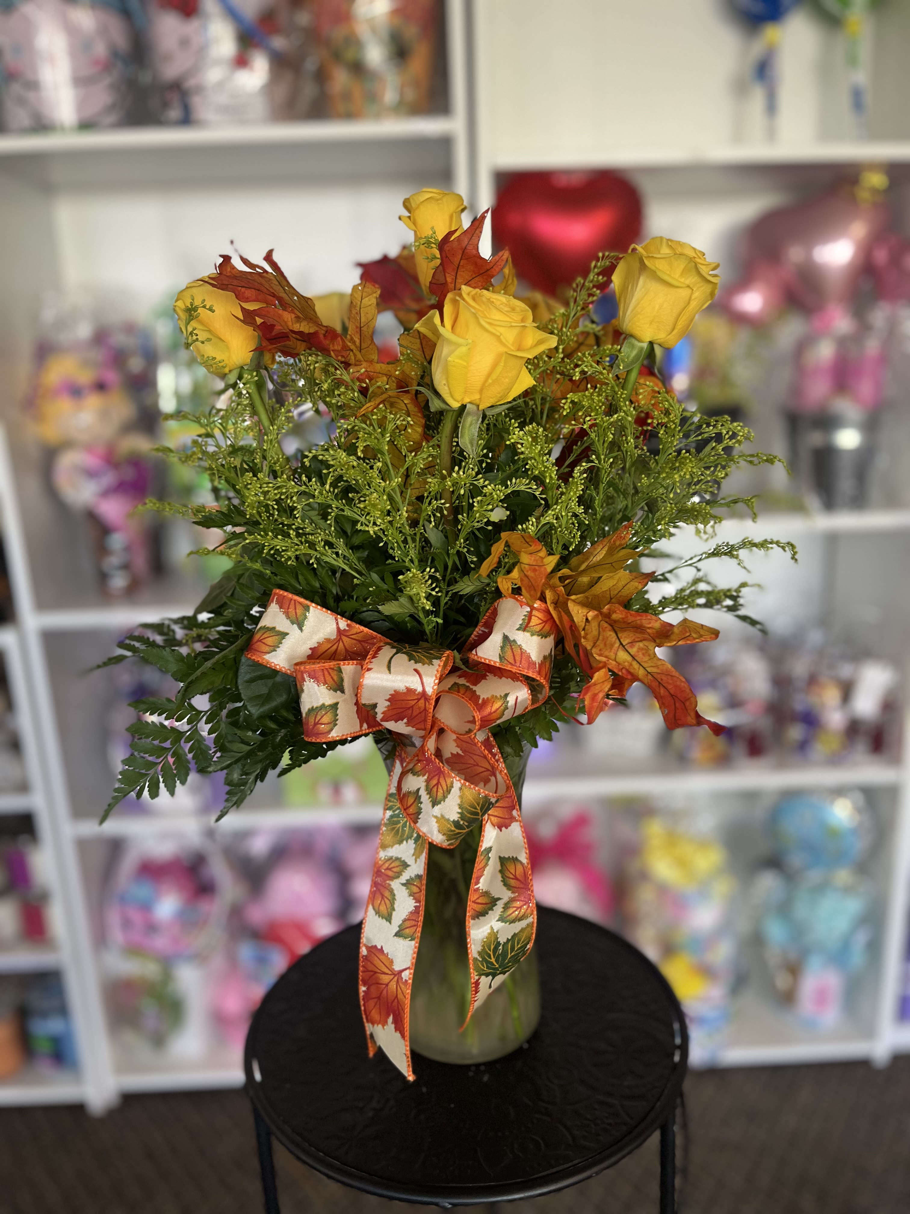 Yellow Fall  - dozen yellow flowers in fall setting 