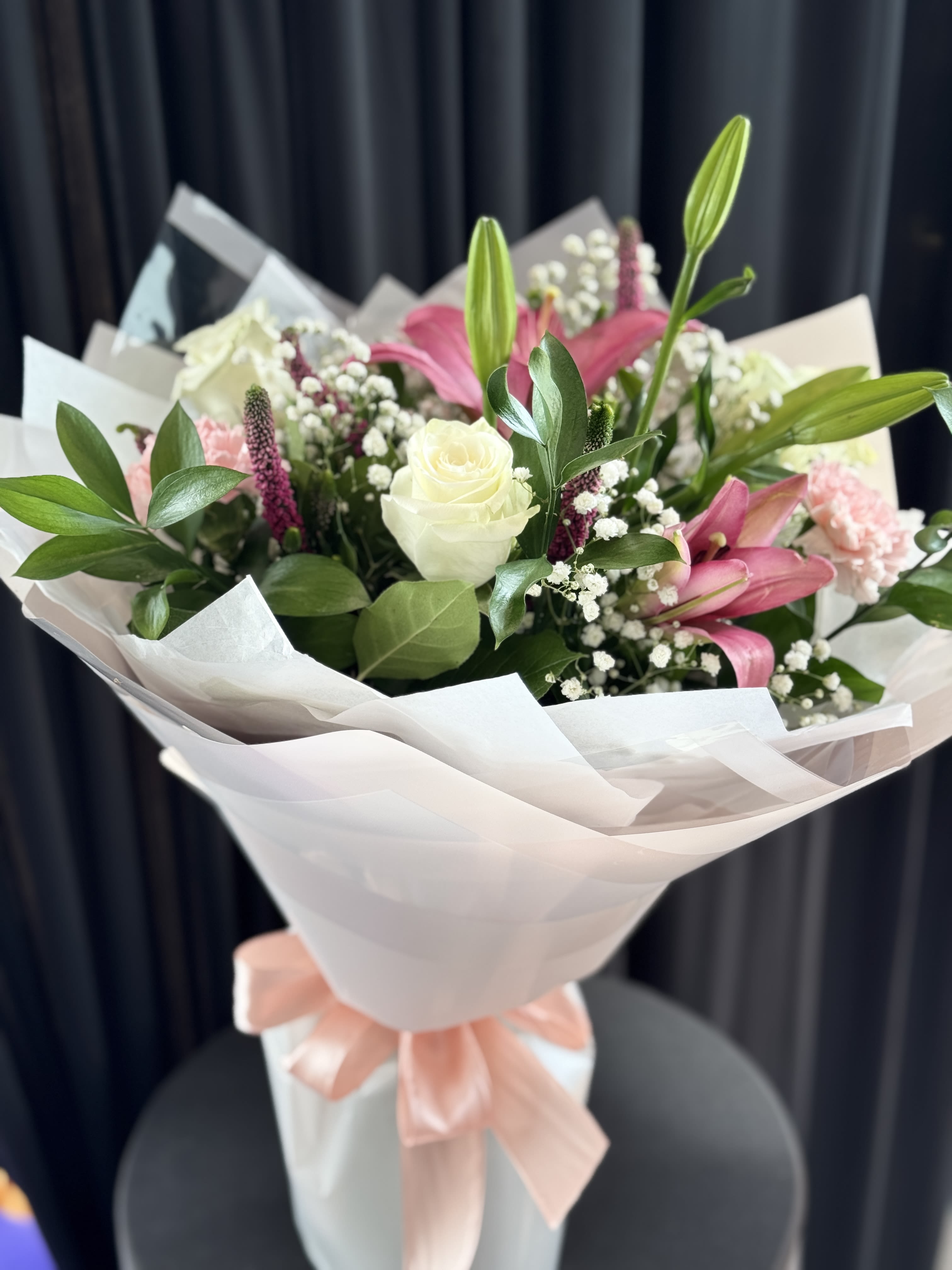 Pink Arrangements  - In some instances, our photo may represent an overall theme or look and include a one-of-a-kind vase which cannot be exactly replicated.  Although the actual bouquet may not precisely match the photo, its temperament will. Occasionally, substitutions of flowers and/or containers happen due to weather, seasonality and market conditions which may affect availability. If this is the case with the gift you’ve selected, we will ensure that the style, theme and color scheme of your arrangement is preserved and will only substitute items of equal value or higher value.  If any design elements are of major importance to your order, please include them in the florist instructions at checkout or contact us to ensure availability.