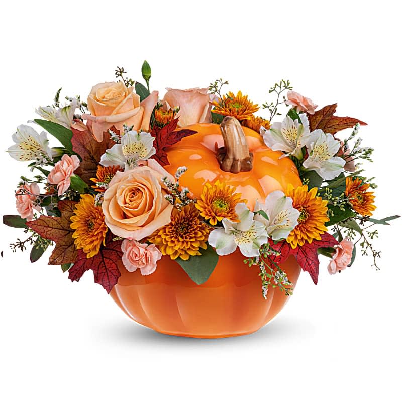 Hello Pumpkin Bouquet - Welcome Fall into your home with this warm and cozy, Hello Pumpkin arrangement. The autumnal mix will add a sophisticated touch with crème roses combined with the warm hues of bronze chrysanthemums and peach mini carnations! This charming arrangement features crème roses, white alstroemerias, peach miniature carnations, bronze cushion spray chrysanthemums, and seeded eucalyptus. Delivered in the Hauntingly Pretty Pumpkin.