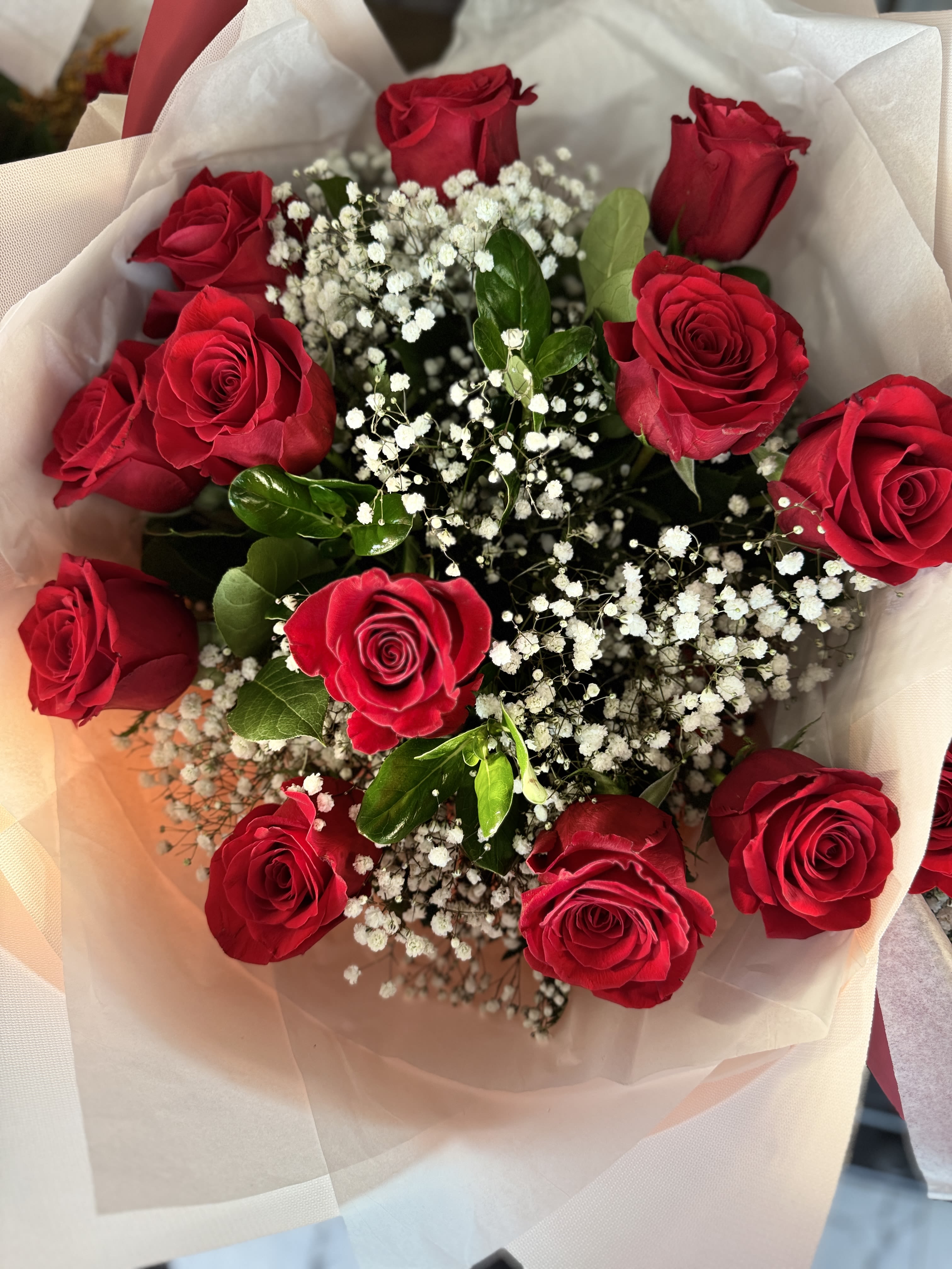 Dozen Red Roses  - In some instances, our photo may represent an overall theme or look and include a one-of-a-kind vase which cannot be exactly replicated.  Although the actual bouquet may not precisely match the photo, its temperament will. Occasionally, substitutions of flowers and/or containers happen due to weather, seasonality and market conditions which may affect availability. If this is the case with the gift you’ve selected, we will ensure that the style, theme and color scheme of your arrangement is preserved and will only substitute items of equal value or higher value.  If any design elements are of major importance to your order, please include them in the florist instructions at checkout or contact us to ensure availability.