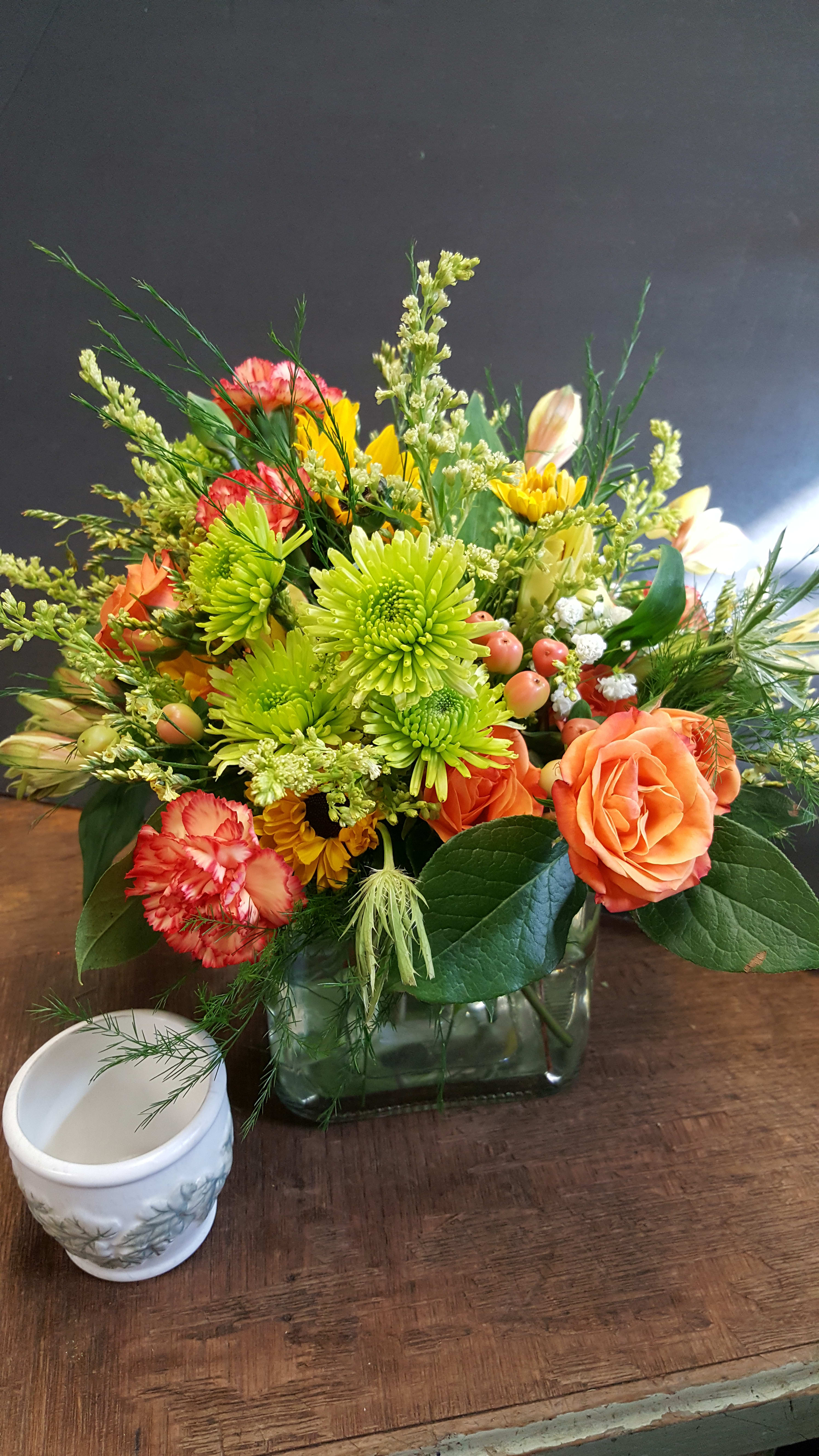 Beverly Crossing Beverly Crossing - Pave' cube or bubble bowl design. Brite hue of colors with a variety of florals, fillers & greens. Sample photo of shape & size! Flowers & brite will vary based on fresh market mix available.