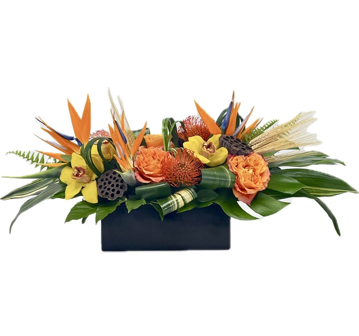 Tropifall  Tropifall  - This Arrangement will be the star of any Fall Autumn Party with its Beautiful Pincushion Proteas, Orange Roses, Birds of Paradise, Yellow Cymbidium Orchid Blooms and Lush Assortment of Different Foliages and Fall Accents such as Lotus Pods and Sprigs of Wheat.