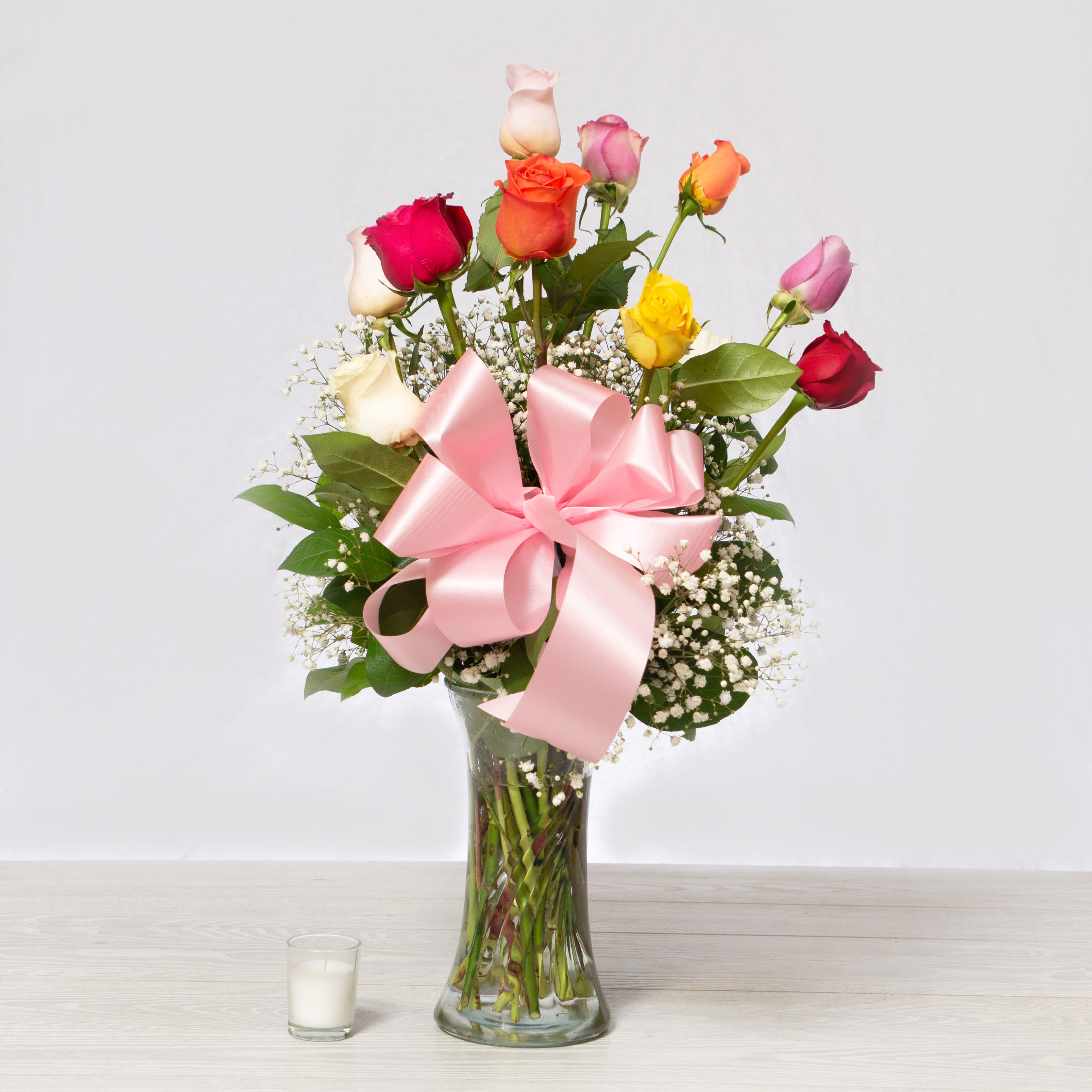 Dozen Mixed Color Roses Dozen Mixed Color Roses - This rose arrangement that brings brilliant color to any of life's special occasions, our Long Stemmed Mixed Rose Arrangement will delight your special recipient with each fragrant bloom.