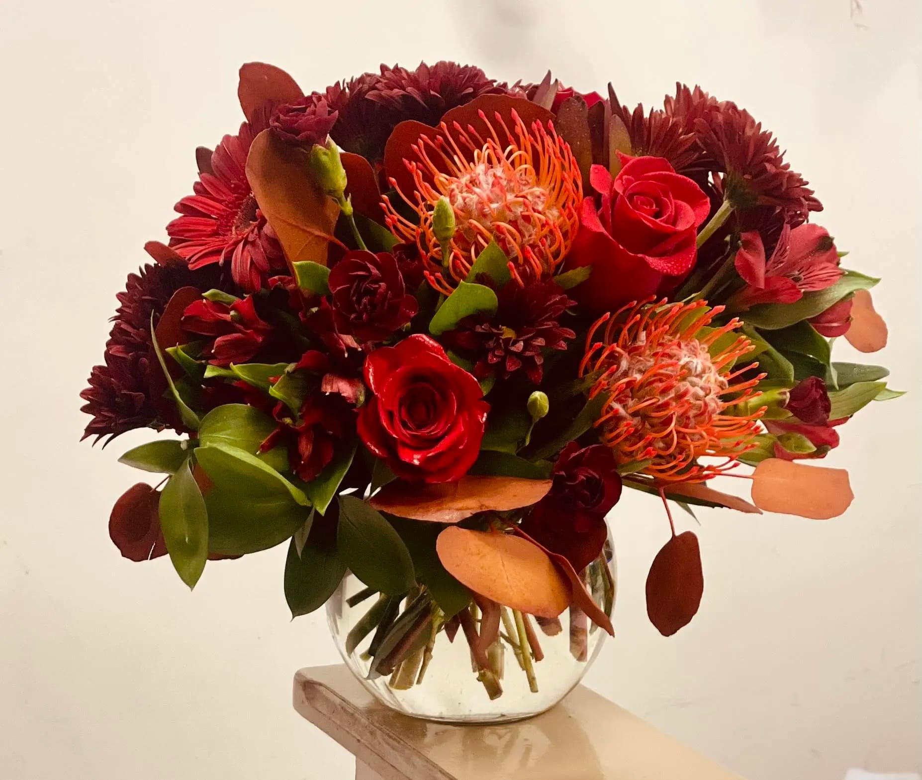 Burgundy Bliss Bouquet Burgundy Bliss Bouquet - The combination of red, burgundy, and rustic colors creates an enchanting tapestry of emotions. Red, symbolizing love and passion, speaks volumes of desire and devotion. Burgundy adds depth and sophistication, while rustic colors bring a touch of rustic charm and nostalgia. Together, they form arrangements that evoke a sense of luxury and timeless elegance.