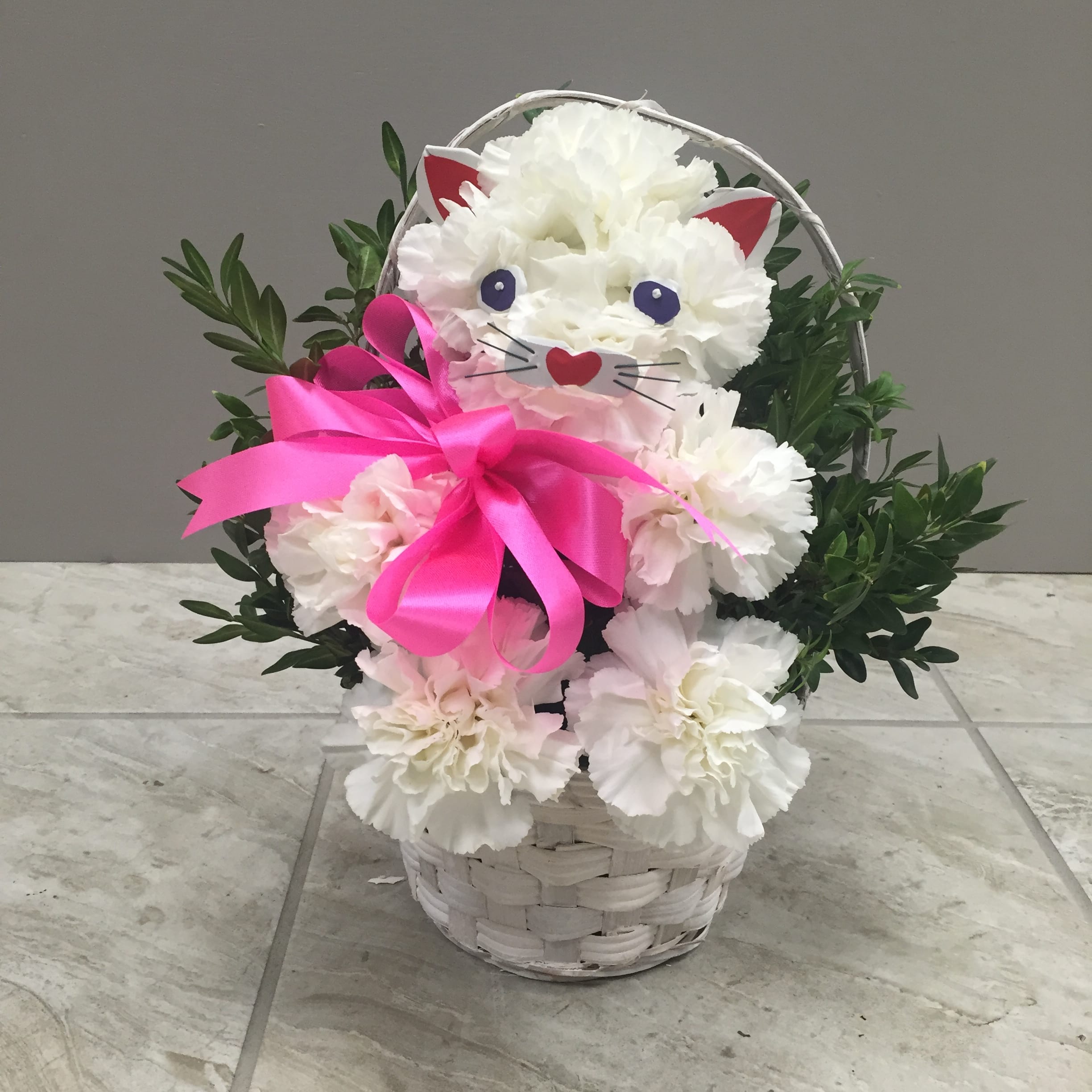 carnations carnations - White carnations kitty cat in a white basket with a pink satin ribbon.