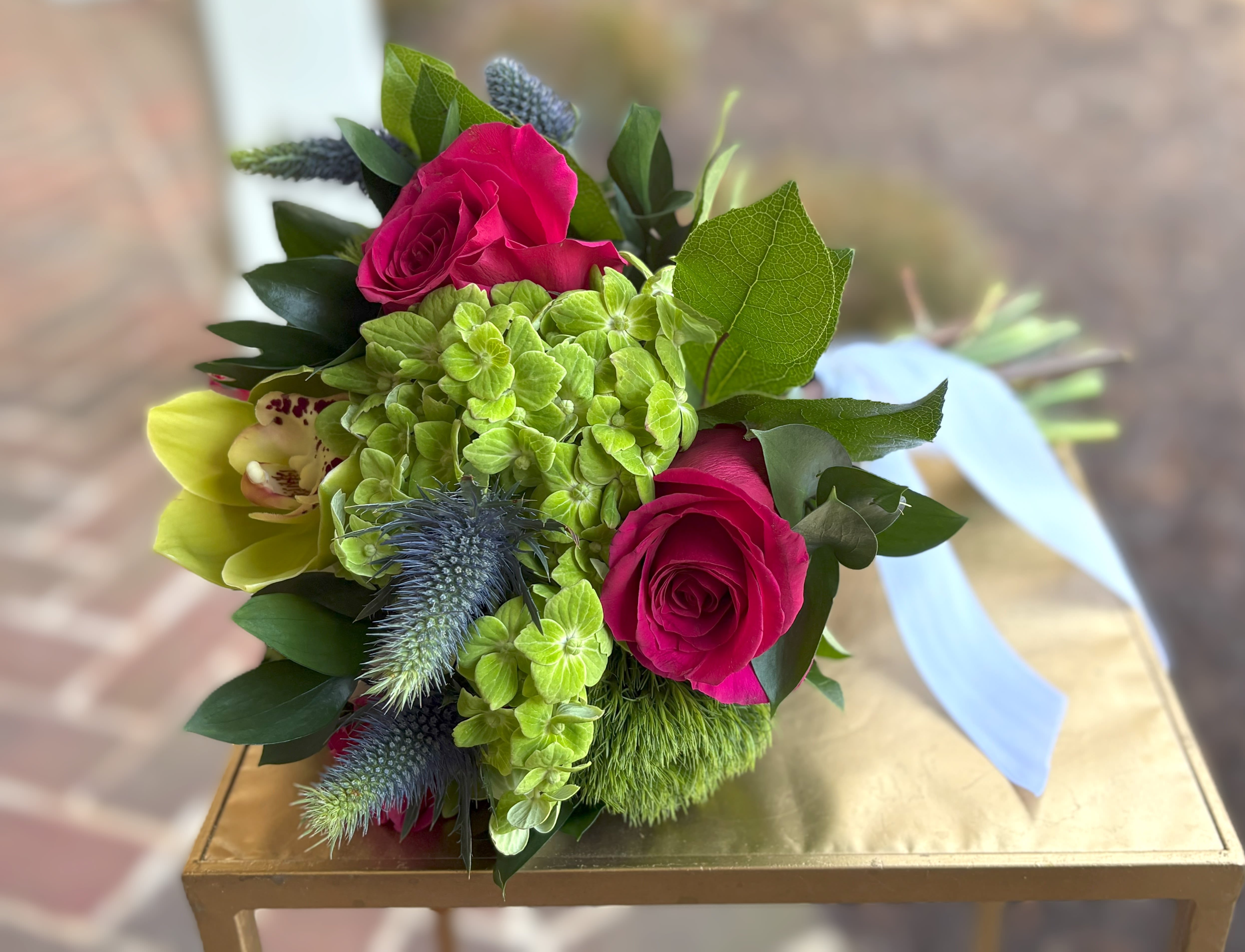 Hot Pink Heaven Bouquet  - Hot pink roses, thistle, green hydrangea, green dianthus and a green orchid. Tax free. Same day hand delivery.  We are a local florist in Wilmington, Delaware that provides the best delivery of fresh flowers on the same day. We also offer next day delivery. Our flower shop services the Wilmington and Newark Delaware areas as well as south eastern PA. We are a flower shop near you that is tax free and provides hand delivered flowers. We offer funeral, sympathy, anniversary, birthday, holiday, Mother's Day, Valentine's Day and rose arrangements and flowers for all occasions. Petals is a full service florist that offers the best online flowers and fresh flower arrangements. You can send flowers from our flower shop to Wilmington, New Castle, Newark, Hockessin, Chadds Ford, Kennett Square and other local cities near us. 