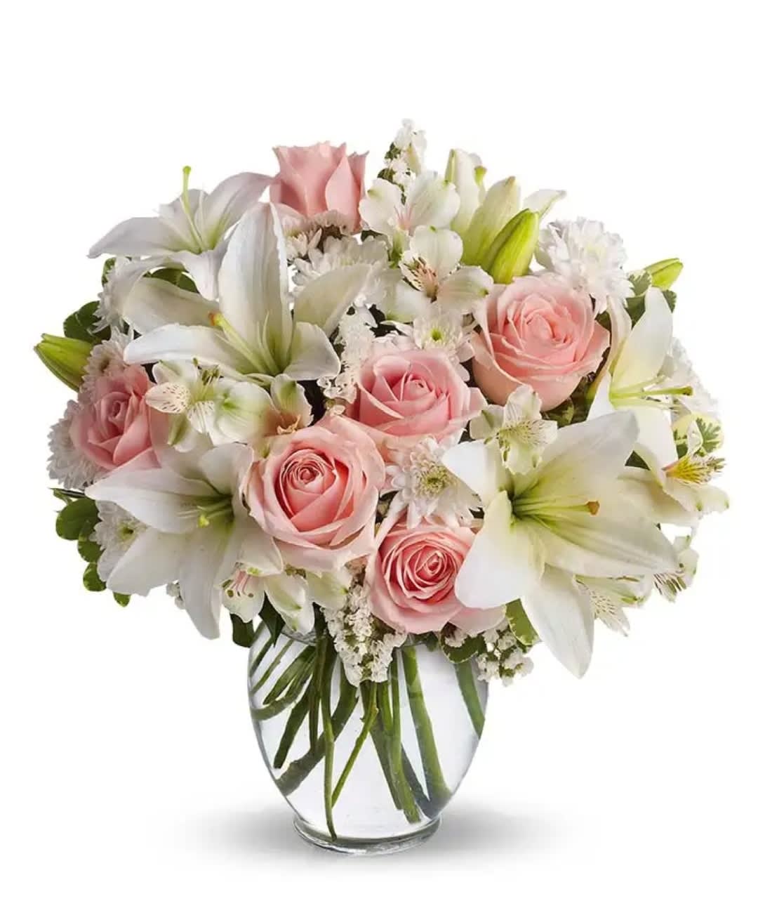 The white and pink of this bouquet.  - A simple way to express you love without saying anything, this arrangement is sure to do the trick. The white and pinks of this bouquet are exquisite, without being overstated. The roses and lilies complement each other, surrounded by other pastel accents in a classic ginger vase. The Serenity and Bliss bouquet is great for any occasion whether you're celebrating a birthday, anniversary or just because!  Includes: • Pink Roses • White Asiatic Lilies • Alstroemeria • White Cushion Spray Mums • Glass Vase