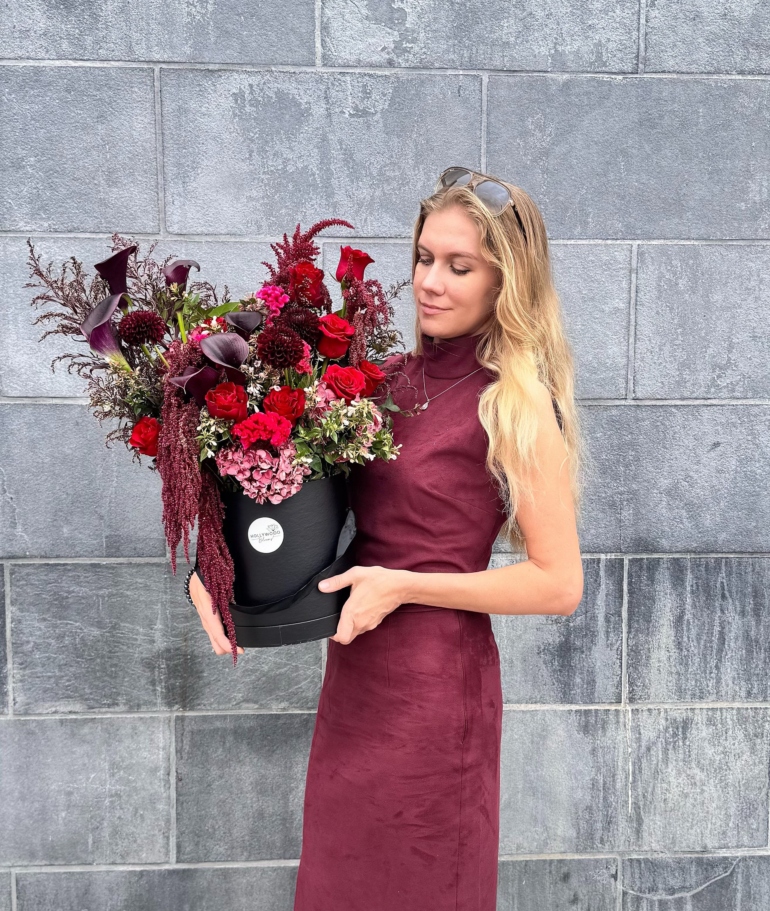 Midnight Elegance – Luxury Red and Burgundy Flowers in a Black Box Midnight Elegance – Luxury Red and Burgundy Flowers in a Black Box - Turn heads with this striking luxury flower box arrangement, featuring deep red roses, burgundy calla lilies, and velvety seasonal blooms designed in rich jewel tones. Perfect for making a dramatic statement, this bouquet embodies elegance and sophistication, created by our expert Hollywood florist team. Presented in a sleek black hatbox with cascading textures, this arrangement is ideal for romantic surprises, luxury events, or as a bold gift that leaves a lasting impression. With our same day flower delivery in Los Angeles, you can surprise someone special right on time with unforgettable style. Whether you’re searching for flowers in a box, chic floral arrangements, or luxury flower delivery Los Angeles, this dramatic hatbox design will elevate any occasion with passion and refinement.