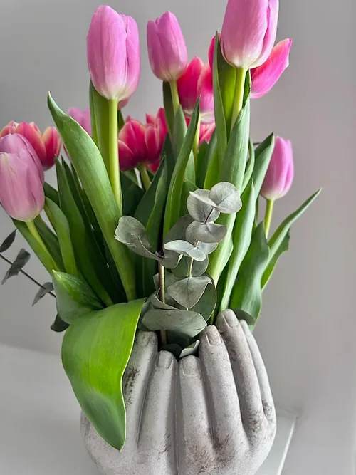 Loving Hands Arrangement - Our Loving Hands Arrangement comes in a 7&quot; H solid concrete vase filled with a selection of seasonal fresh flowers and greens  Bouquet will be delivered approximately as pictured.  