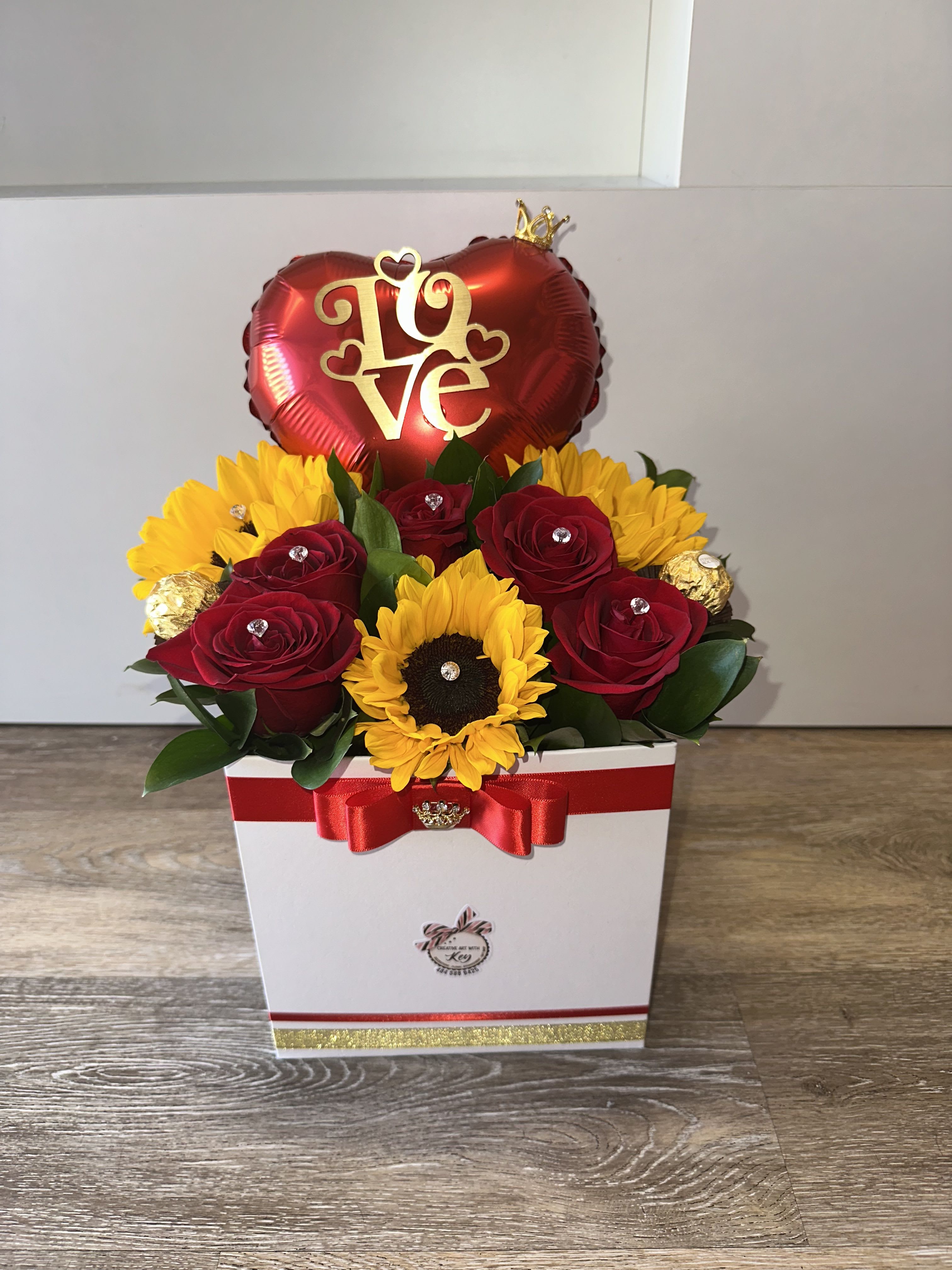 Ferrero, ballon , sunflowers and roses Ferrero, ballon , sunflowers and roses - Sunflower and roses