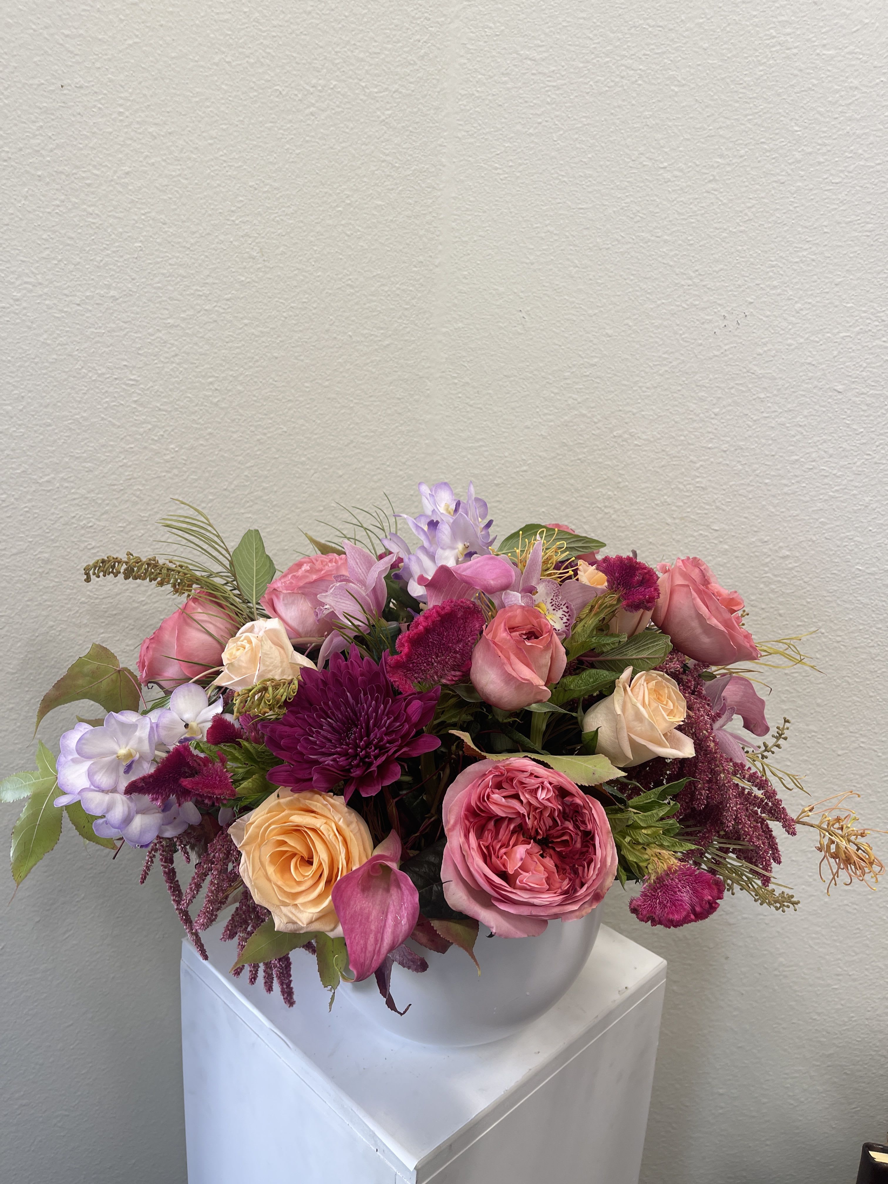 Strawberry Fields - Lush Roses in Berry colors in a garden-like setting. Flowers may vary