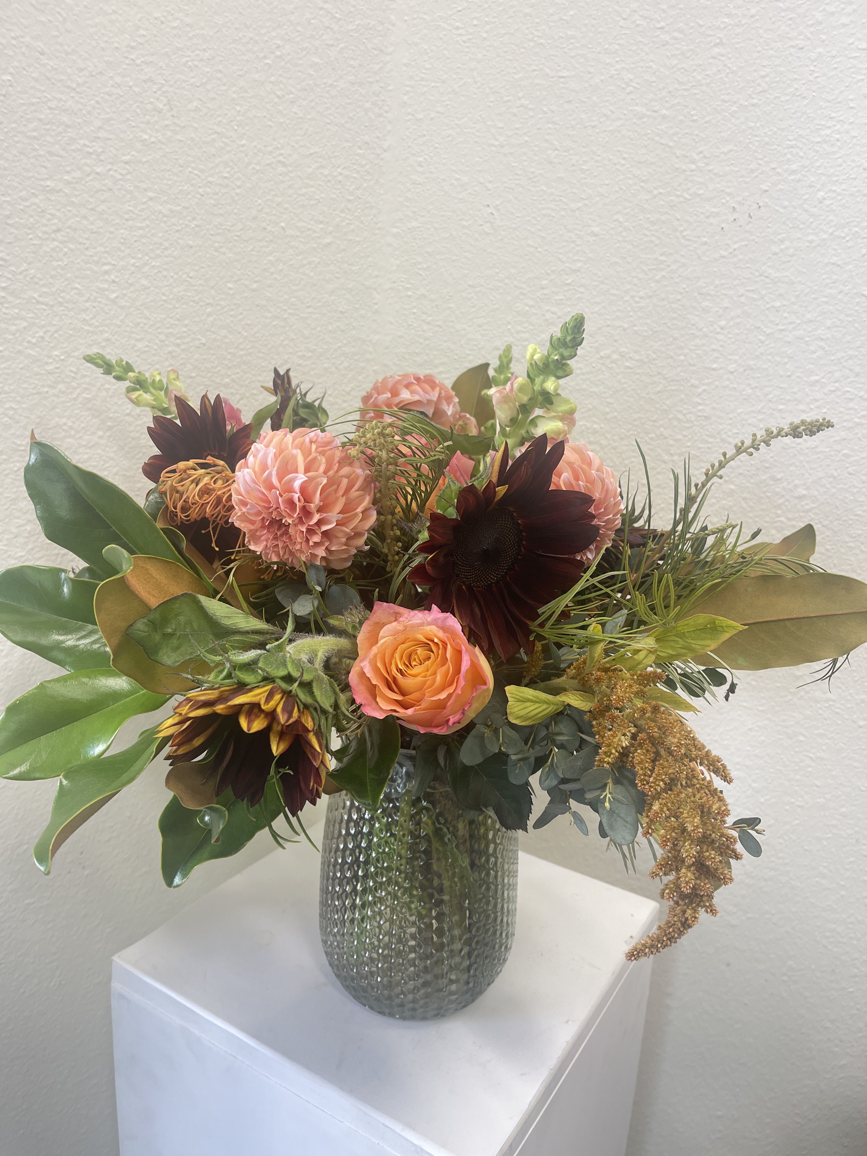 Bronze Autumn - Bronze and Clover colored flowers in a generous sized vased. Flowers may vary depending on availability.