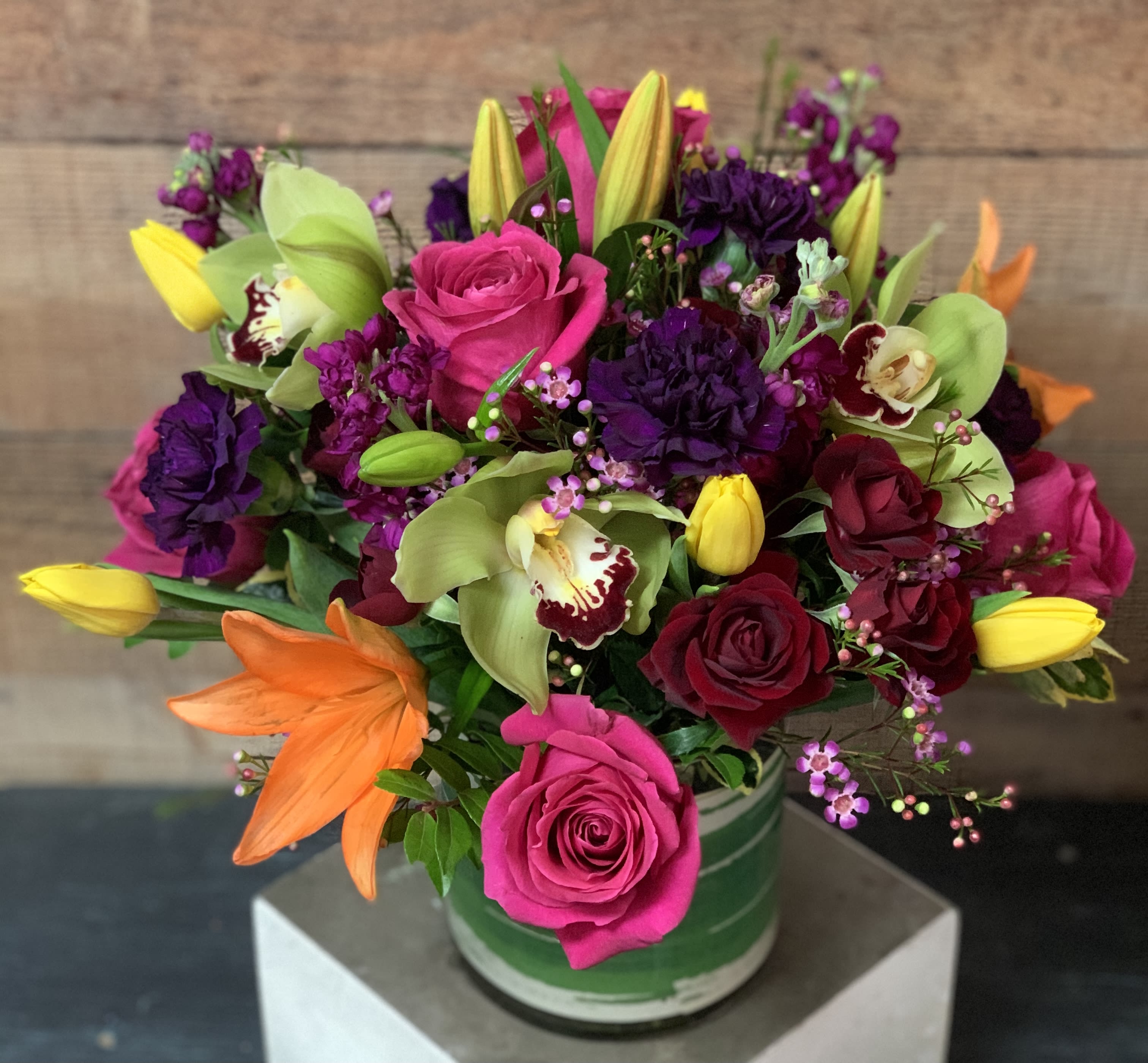 Celebration Celebration - A colorful arrangement of roses, orchids, tulips, carnations and lilies