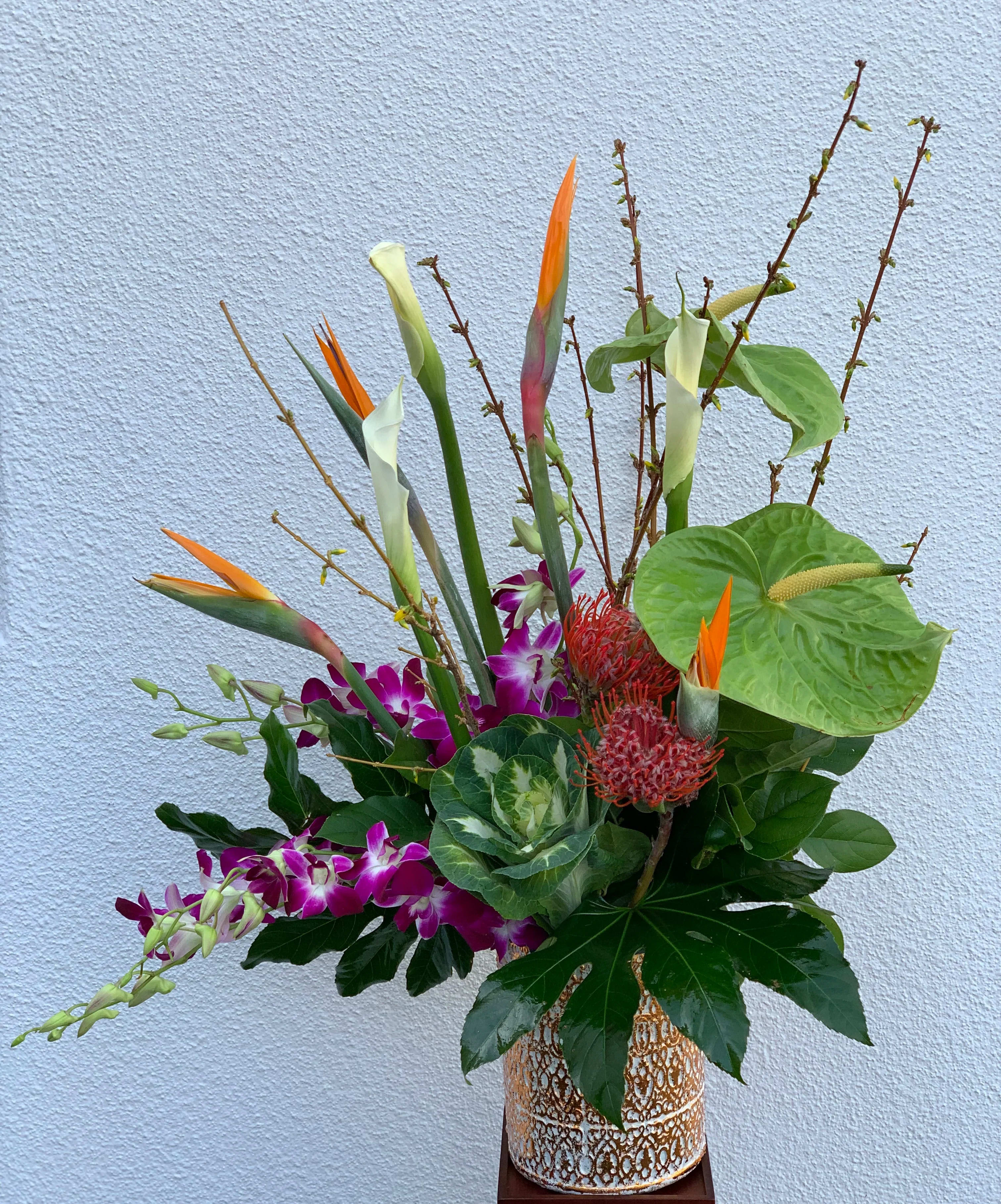 Island Vibes Island Vibes - This one of a kind gift for that someone special consists of Anthurium, Kale, Birds of Paradise, Orchids, and Proteas.
