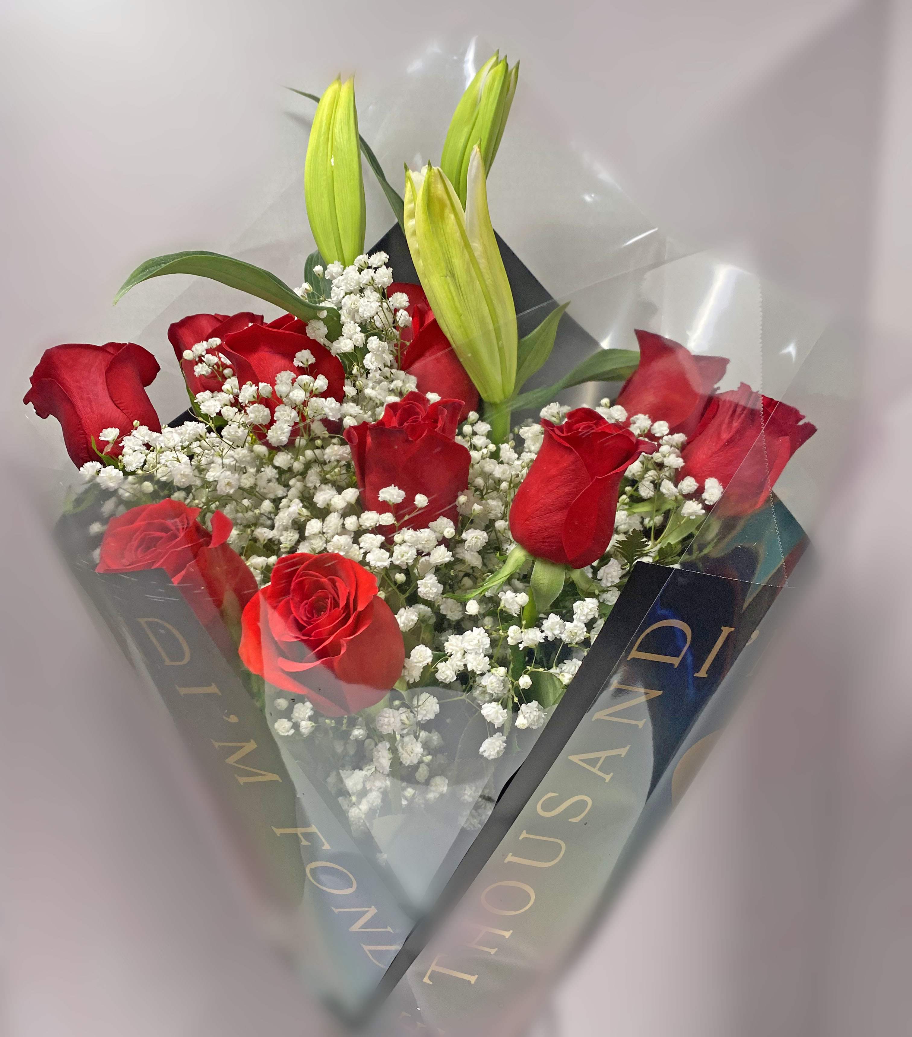 12  Roses and lilies  Bouquet - Bouquet of 12 Roses and Lilies special for any occasion Deluxe: 20 Red Roses Premium:25 Red Roses