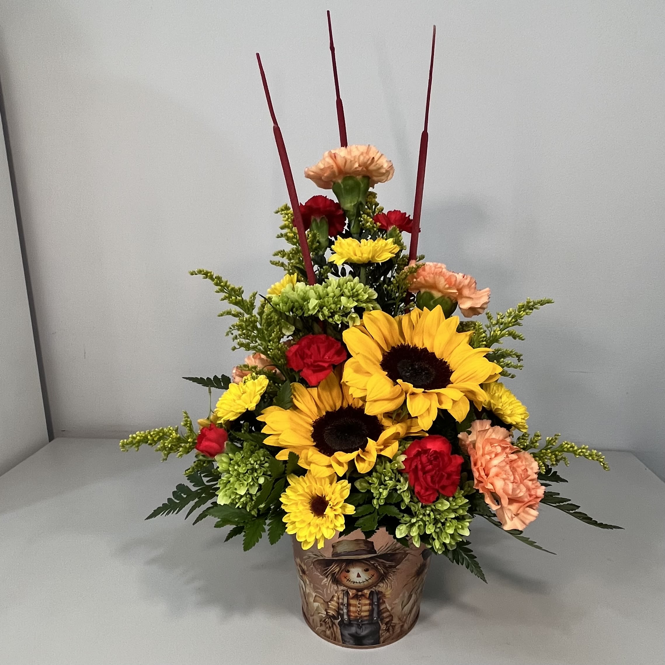 Fall Scarecrow - Metal Pot with Scarecrow design on pot filled with Sunflowers and mixed fall flowers ( flowers may be different due to availability)
