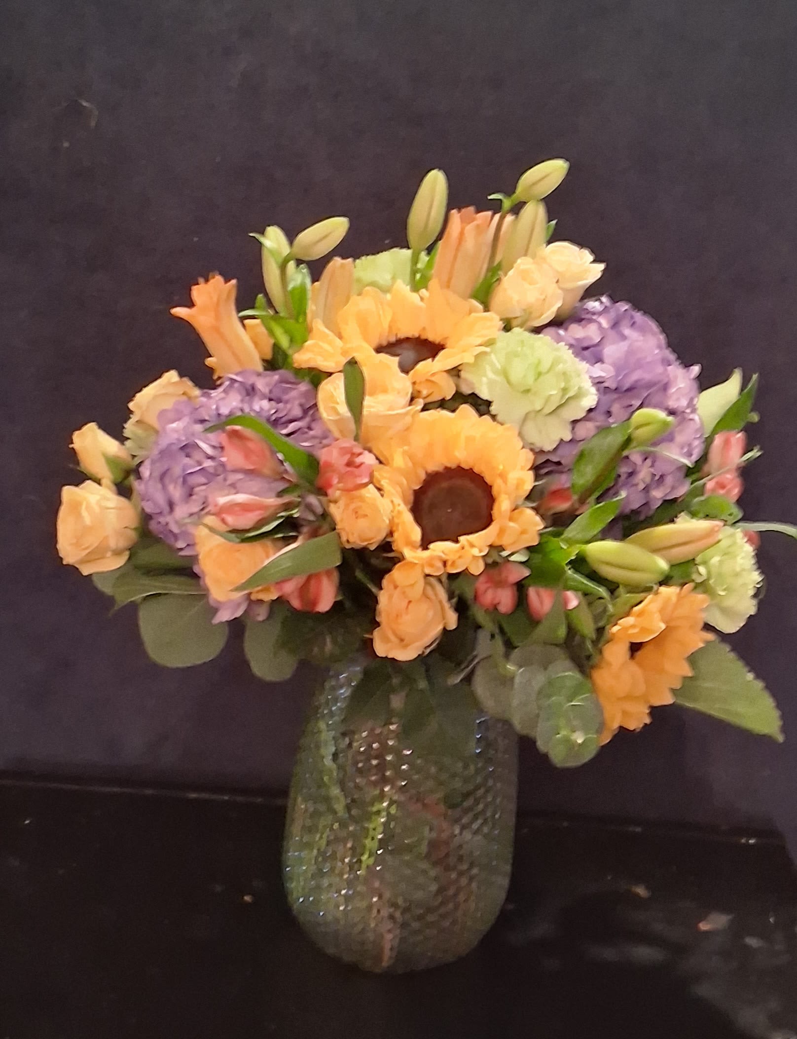 Marvelous mixture - This mixed arrangement includes sunflowers asiatic and Peruvian lilies carnations hydrangeas and spray roses 