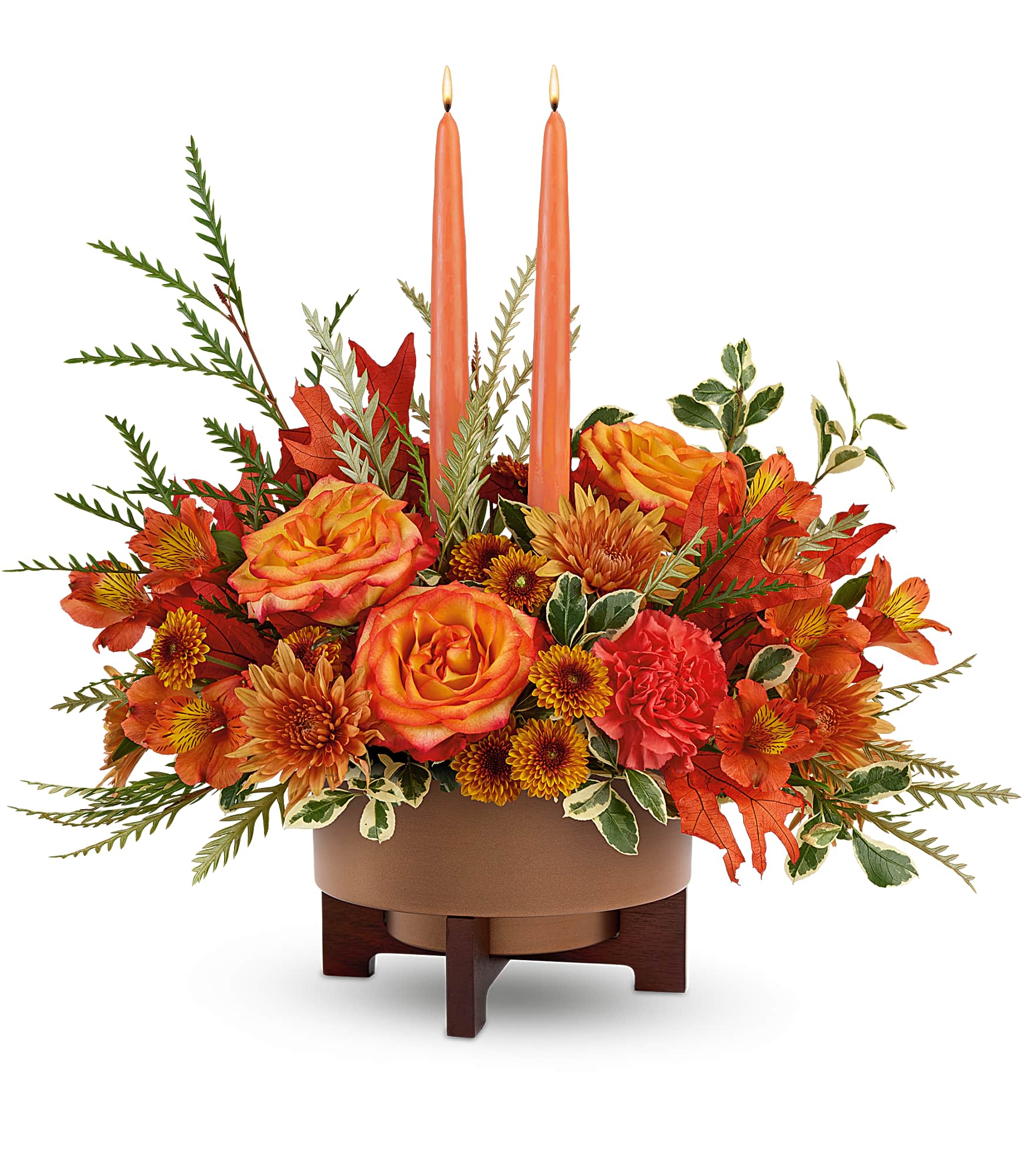 Fall Harvest Centerpiece - Warm hearts and tables with Fall Harvest Centerpiece. Featuring two elegant taper candles and a rich mix of orange blooms, this stunning arrangement shines in our Modern Copper Planter. A perfect fit for Thanksgiving or any occasion this autumn 