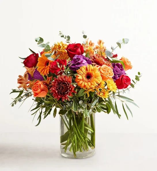 Garden of Grandeur for Fall - We’ve taken one of our best-selling bouquet designs and filled it with all the rich colors and textures of fall. An abundant, garden-inspired mix of blooms is gathered with natural accents inside a clear glass vase. It’s a gift guaranteed to make a grand impression at every gathering.