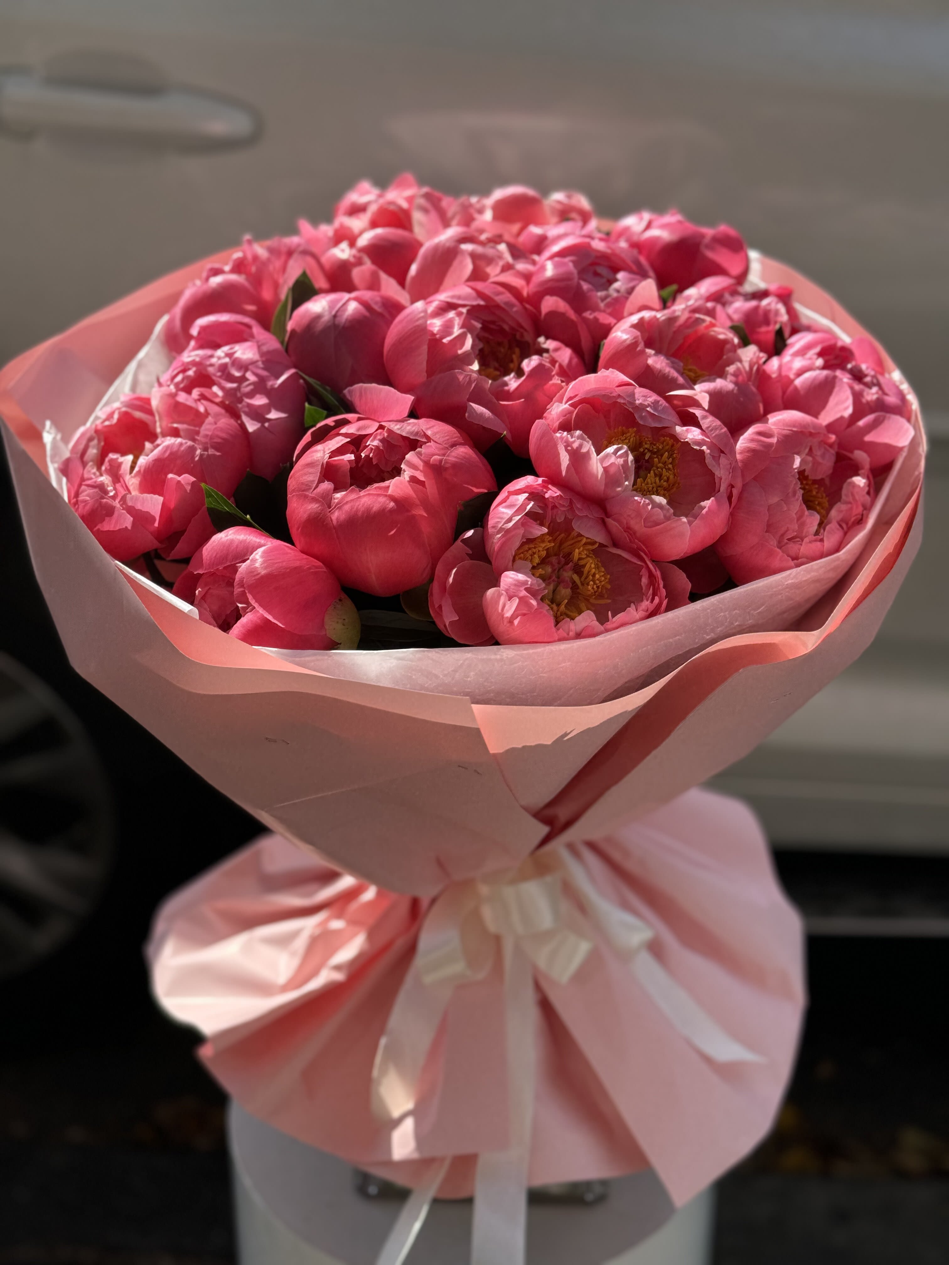 Coral peonies bouquet.    The photo shows a deluxe size. - The photo shows a deluxe size.