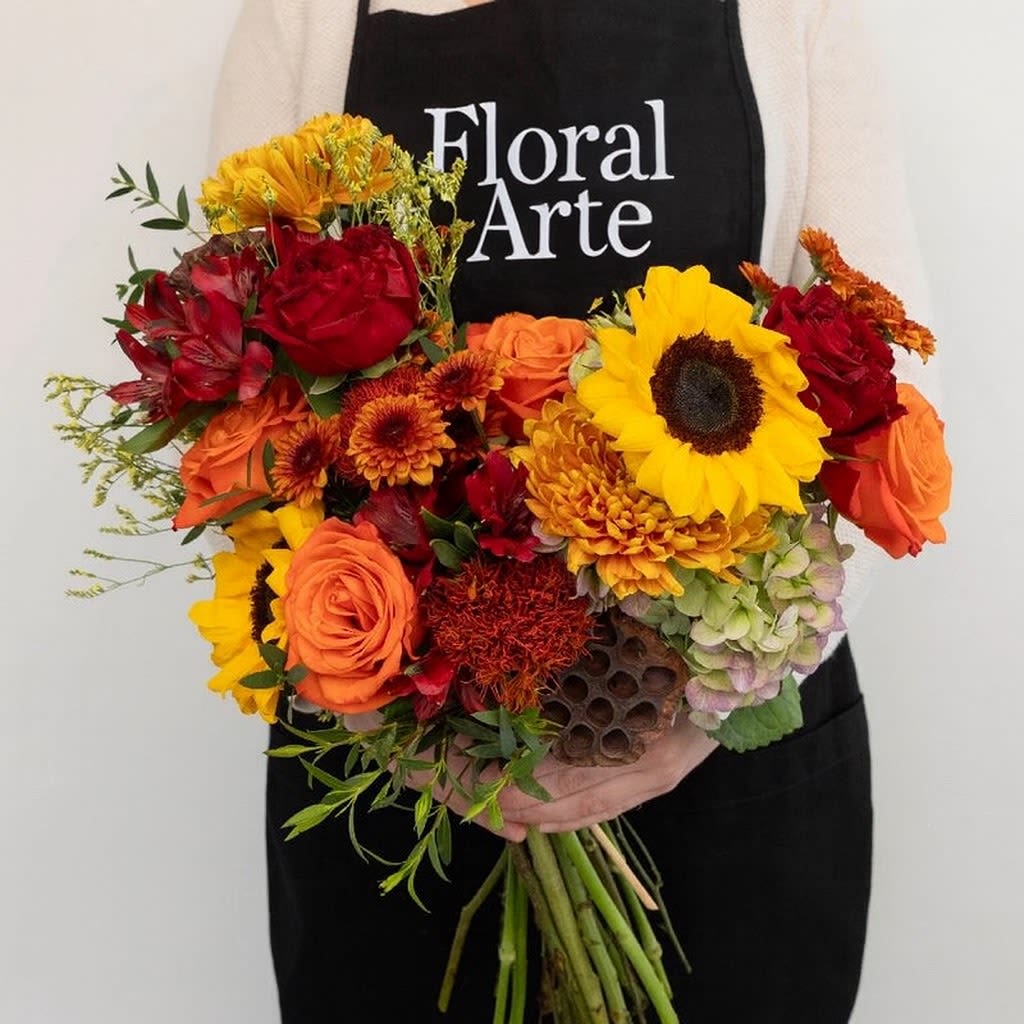 Seasonal Fall Bouquet Seasonal Fall Bouquet - Seasonal Fall Bouquet wrapped in brown craft papel will select the flowers that we have in stock