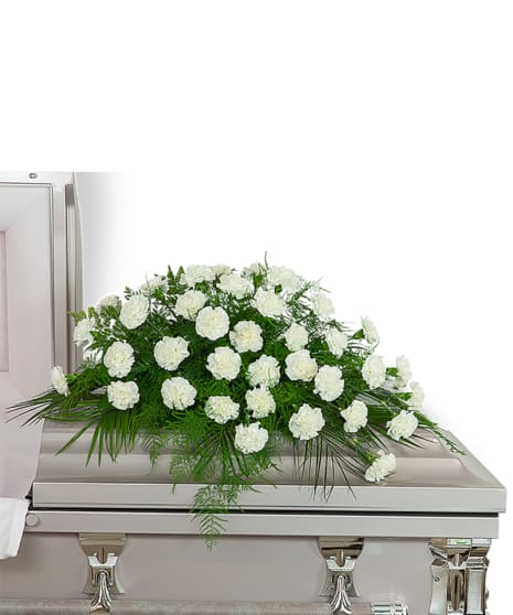 Carnation casket spray - This family remembrance of  your loved one is a simple arrangement of carnations and assorted greens 
