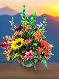 Autumn Pastures - Cool crisp mornings, clean air and the sun just coming up on fields of beautiful autumn colors. That is the look of this lovely designer chosen flower arrangements that will be as unique as the person you are sending it to.