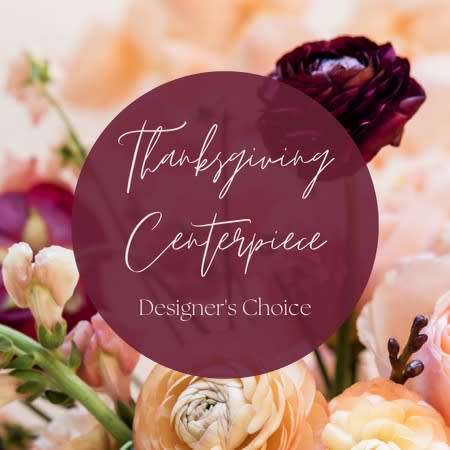 Thanksgiving Centerpiece  Thanksgiving Centerpiece  - A unique, colorful and traditional Happy Thanksgiving Design. With only the freshest premium flowers. Designed for a table setting, in a low compact container.