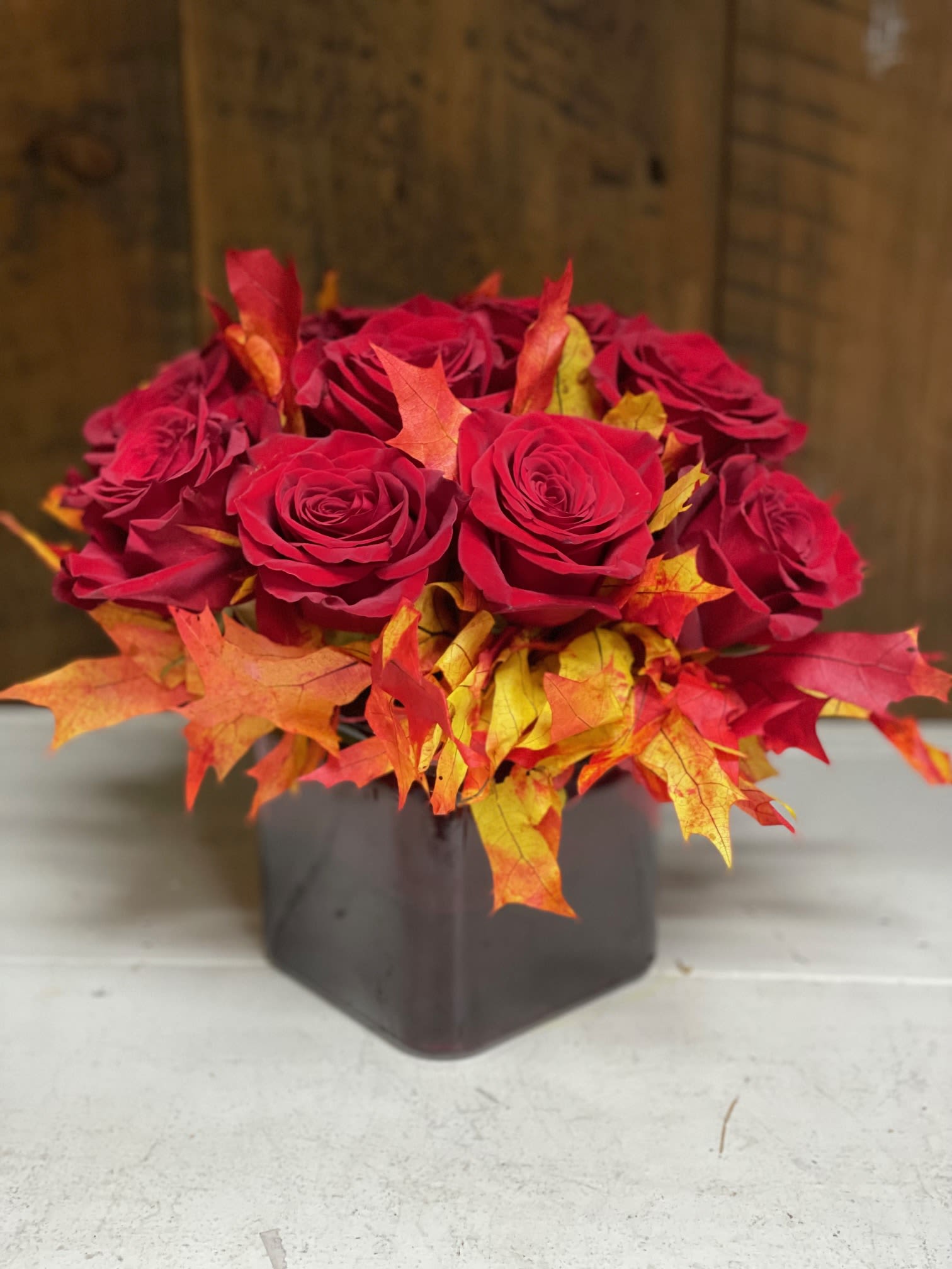 Fall Flair Red Roses - A contemporary dozen with seasonal fall flair.