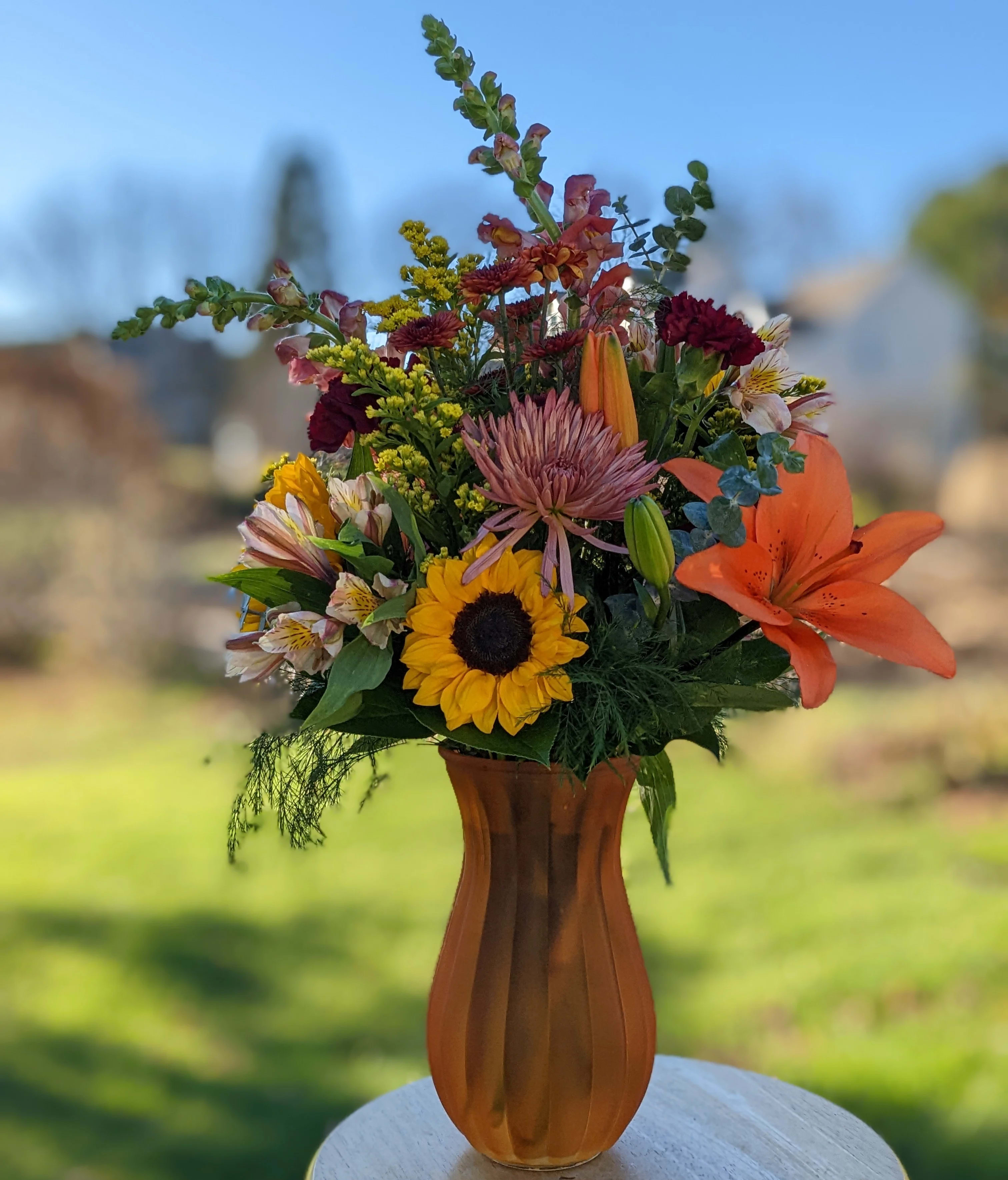 Fall Tones Vase Fall Tones Vase - As simple as pie this vase is great for those who want flowers but aren't sure what to get. Let us decide for you! A fall mix will put a smile on anyone's face. The color of the vase may change depending on availability.
