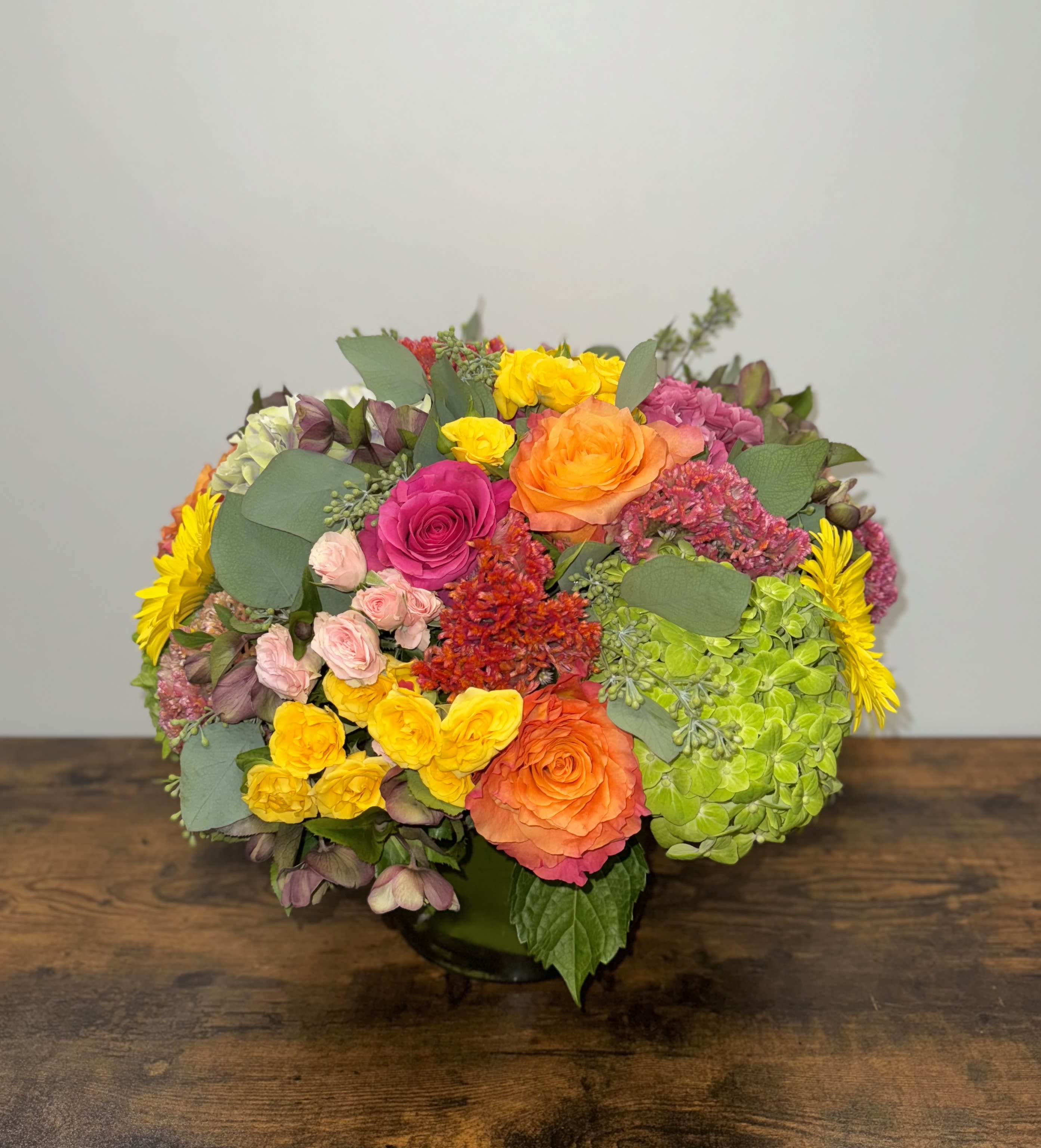 Abundant Sun  - This arrangement is jam packed with bright cheerful colors like orange, yellows, hot pinks.