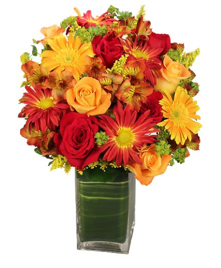 Fall Canvas Bouquet - Fall assorted flowers and colors designed in a class vase. 