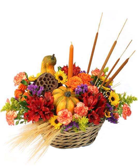 Autumn Gourds - Fall table top basket/ centerpiece. This bouquet is designed with fall florals, small pumpkins, small gourds, wheat, and the look is finished with a single fall candle in the middle. 