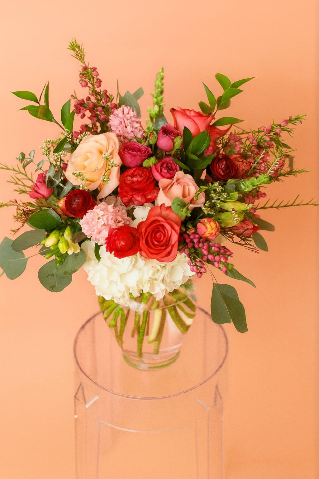 Radiant Mama! - Premium - Fuchsia Radiant Mama! - Premium - Fuchsia - Vibrant and full of heart, Radiant Mama bursts with fuchsia and soft pink roses, tulips, ranunculus, and pretty pink accents. Pick the perfect size for your perfectly radiant mom - whether a sweet splash or a bold bloom! Each arrangement will be carefully created to resemble the photo with a little natural uniqueness in every design.
